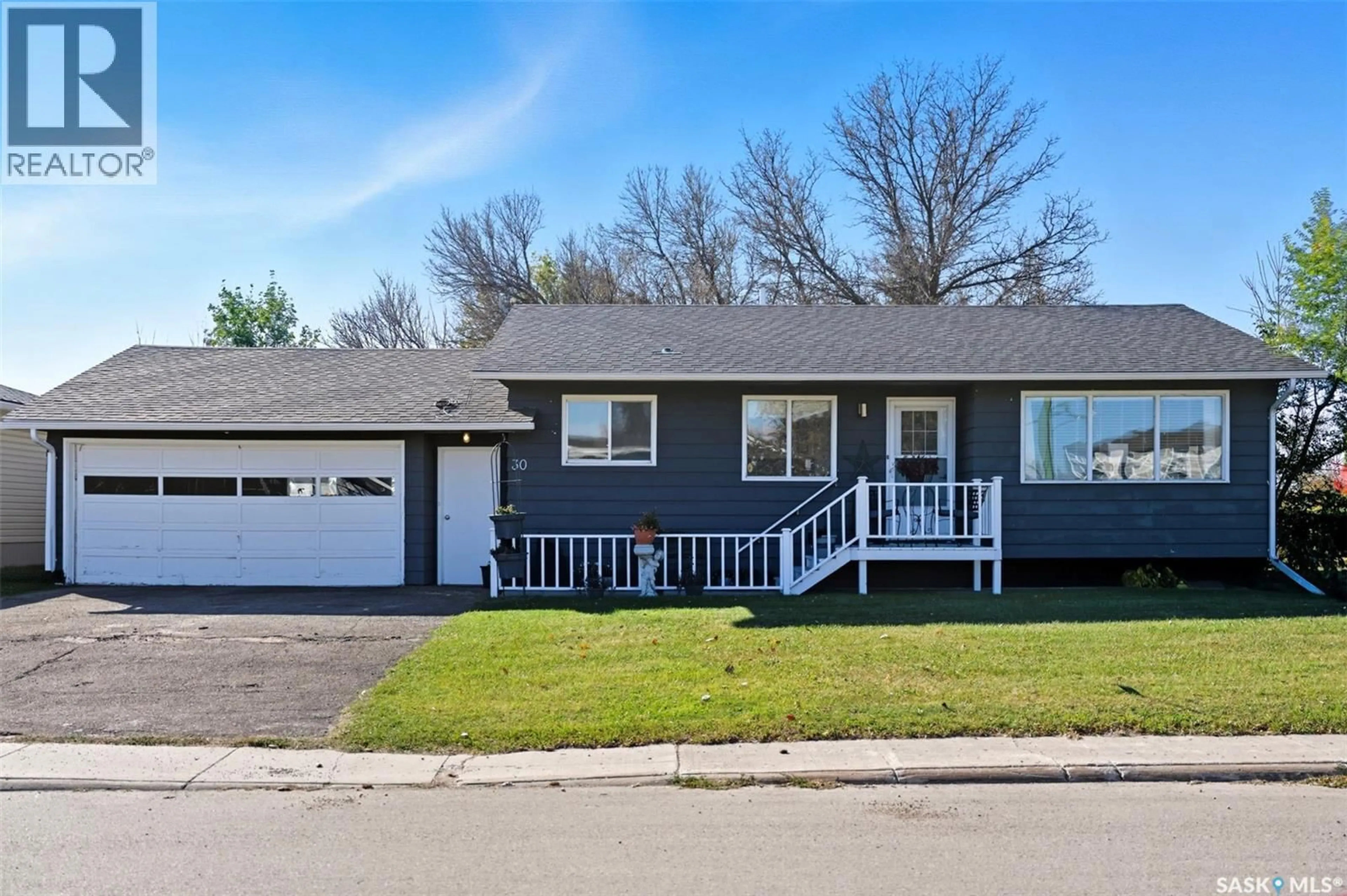 Home with vinyl exterior material, street for 30 CALVERT CRESCENT, Lanigan Saskatchewan S0K2M0