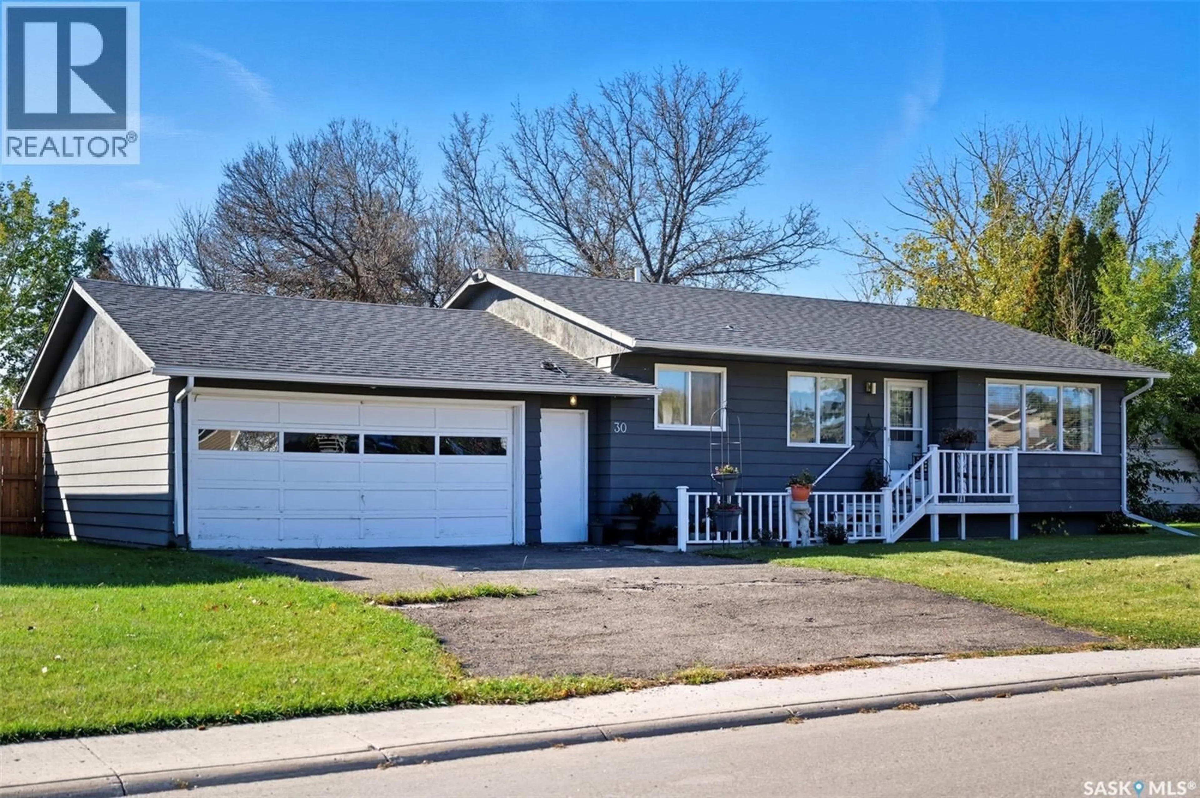 Home with vinyl exterior material, street for 30 CALVERT CRESCENT, Lanigan Saskatchewan S0K2M0