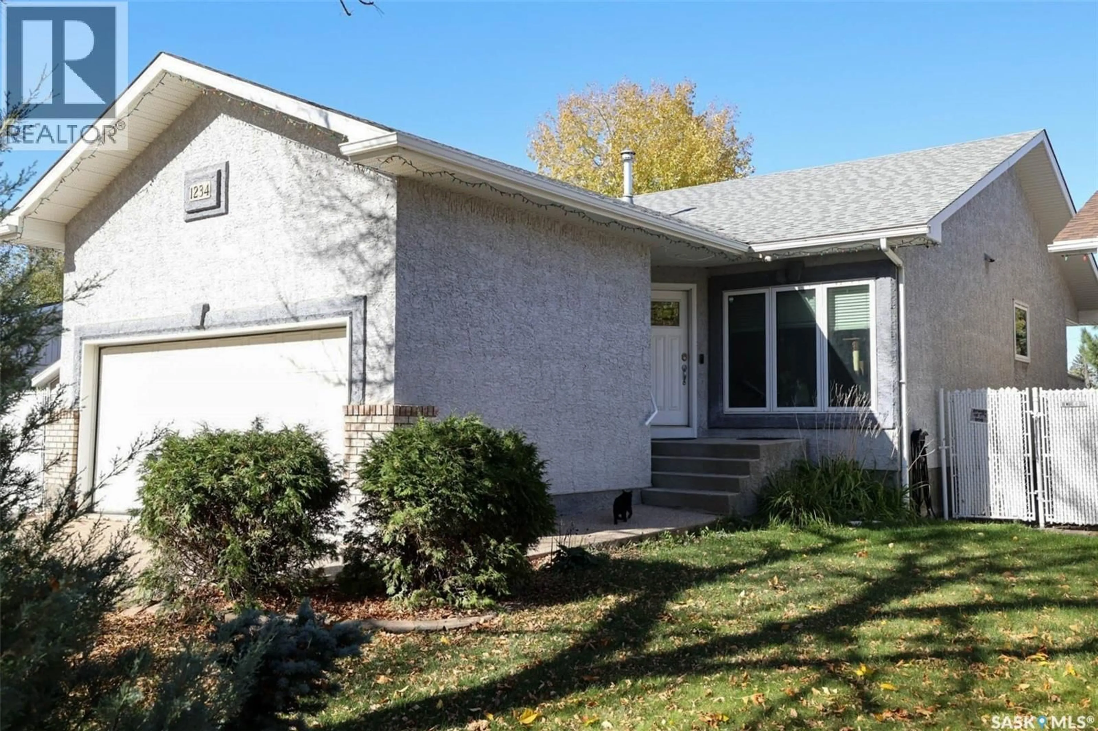 Home with vinyl exterior material, street for 1234 DOVER AVENUE, Regina Saskatchewan S4R0L4