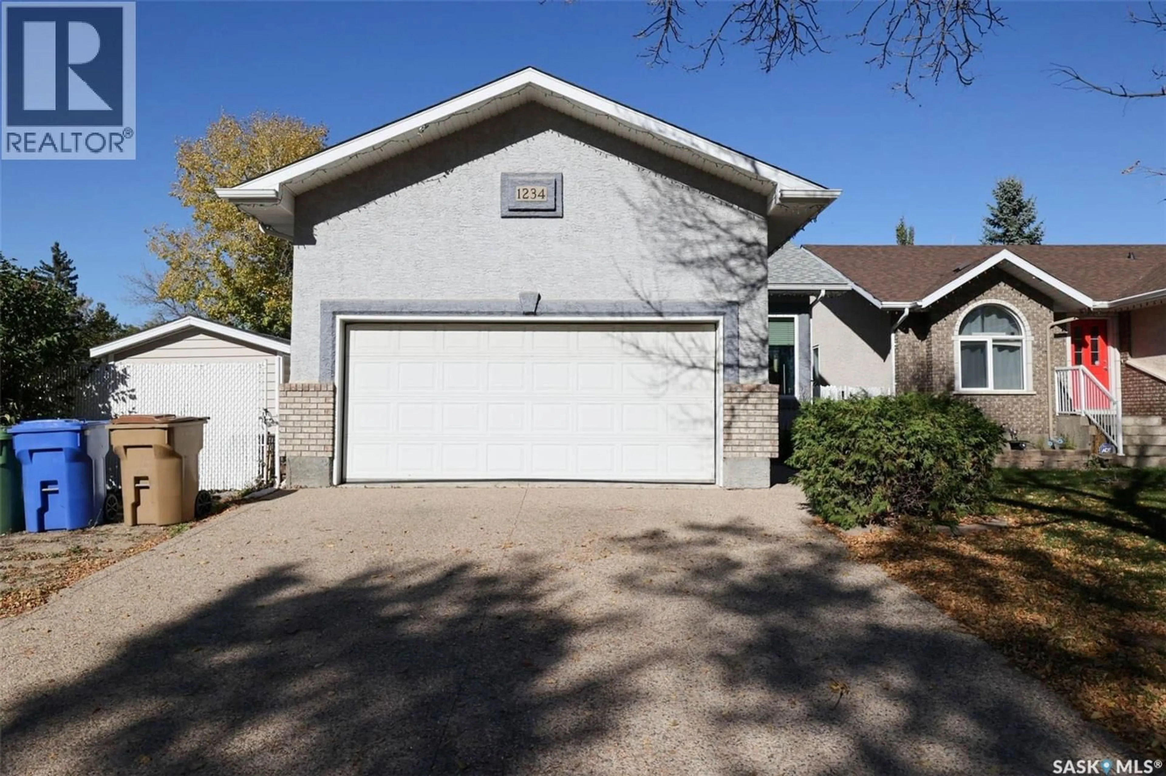 Home with vinyl exterior material, street for 1234 DOVER AVENUE, Regina Saskatchewan S4R0L4