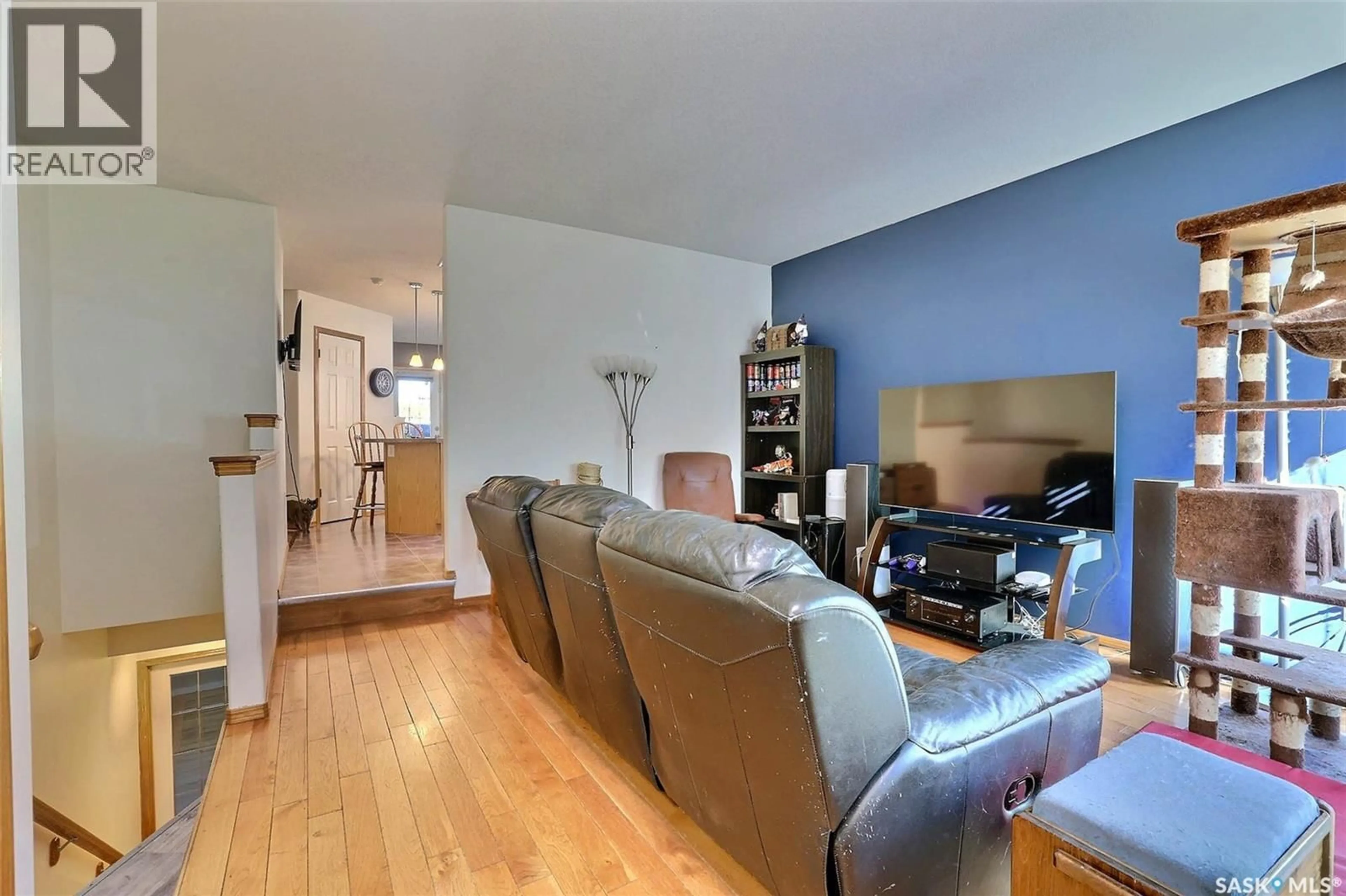 Living room with furniture, wood/laminate floor for 1234 DOVER AVENUE, Regina Saskatchewan S4R0L4