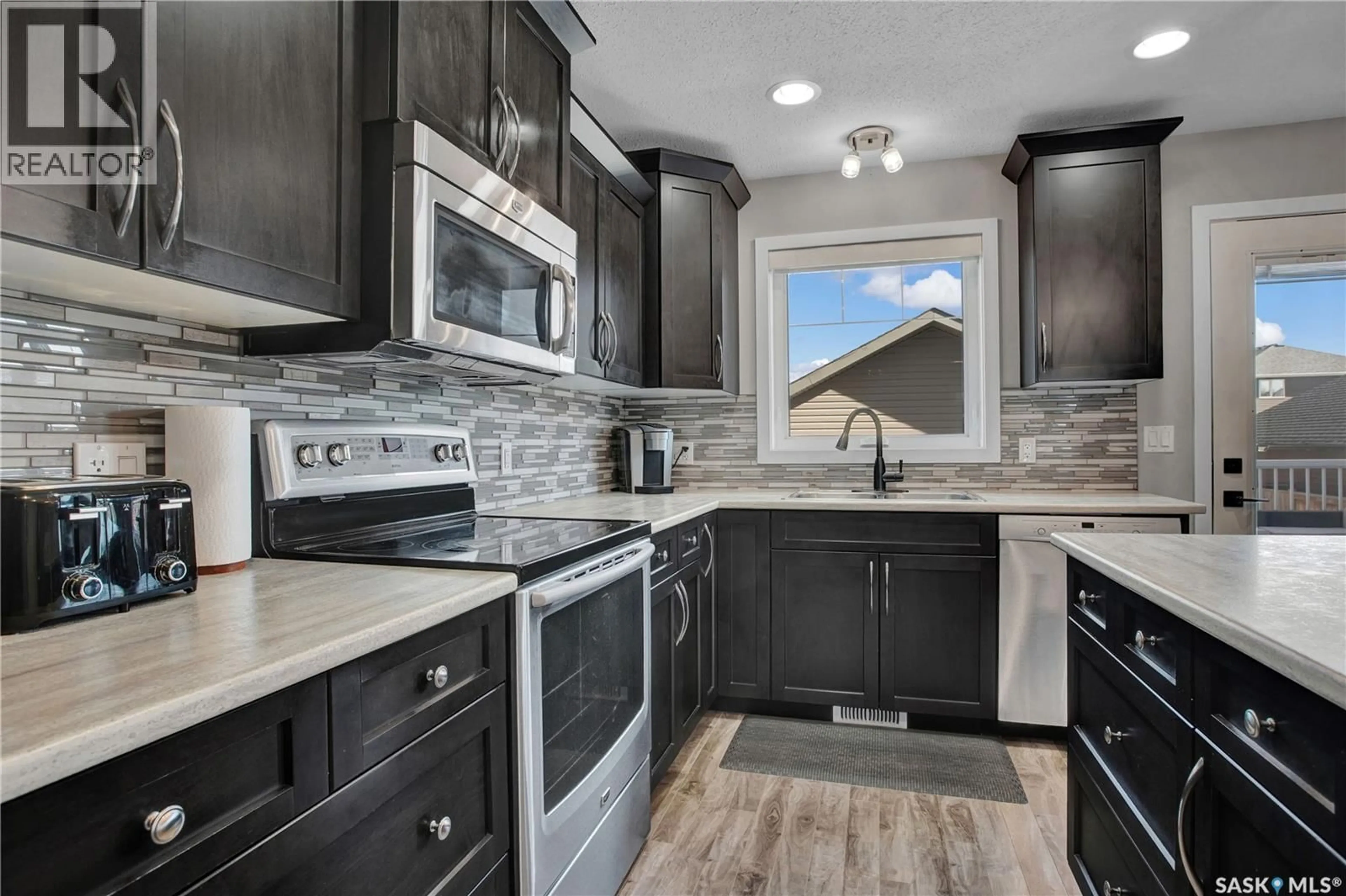 Open concept kitchen, ceramic/tile floor for 422 REDWOOD CRESCENT, Warman Saskatchewan S0K4S2