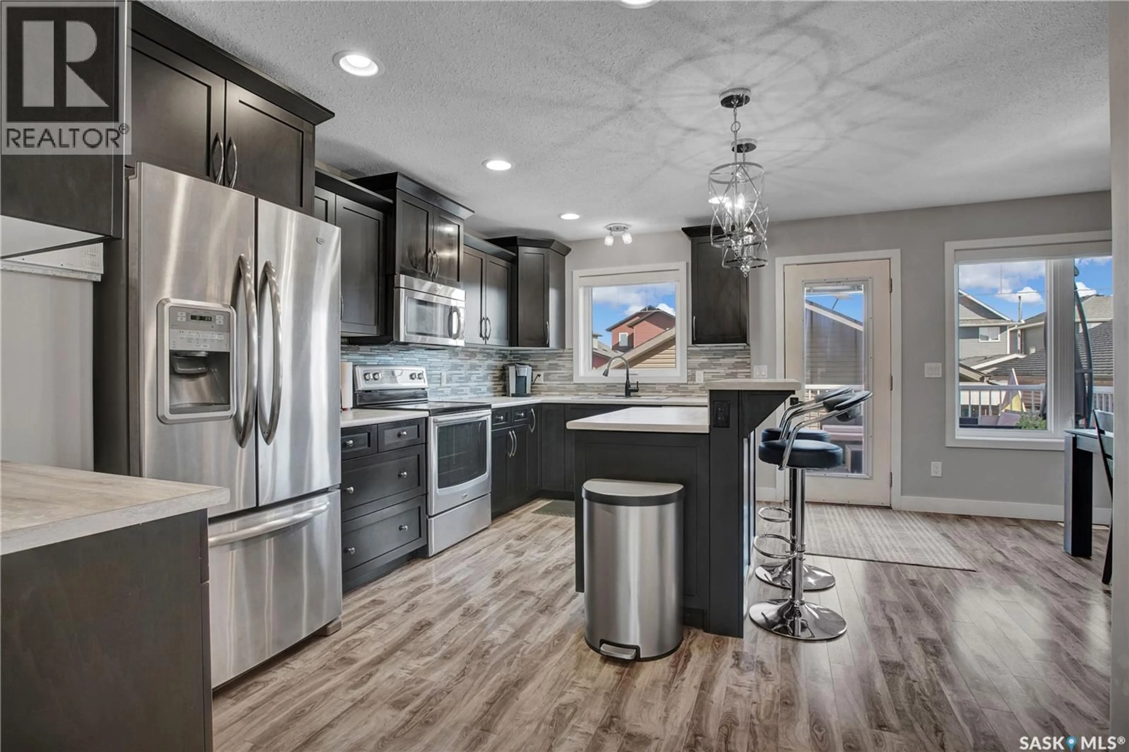 Open concept kitchen, unknown for 422 REDWOOD CRESCENT, Warman Saskatchewan S0K4S2