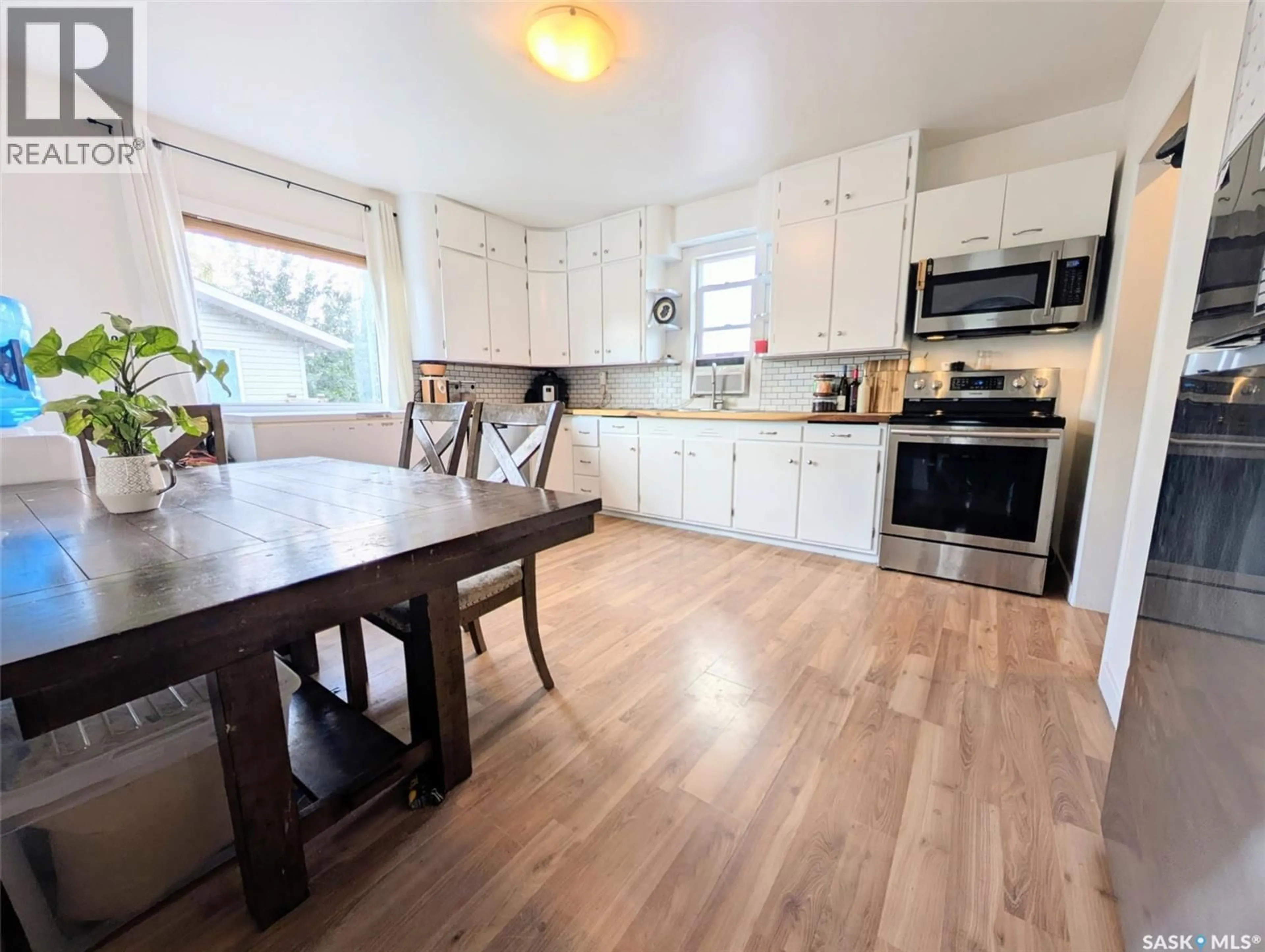 Open concept kitchen, wood/laminate floor for 120 COLBORNE AVENUE, Viscount Saskatchewan S0K4M0