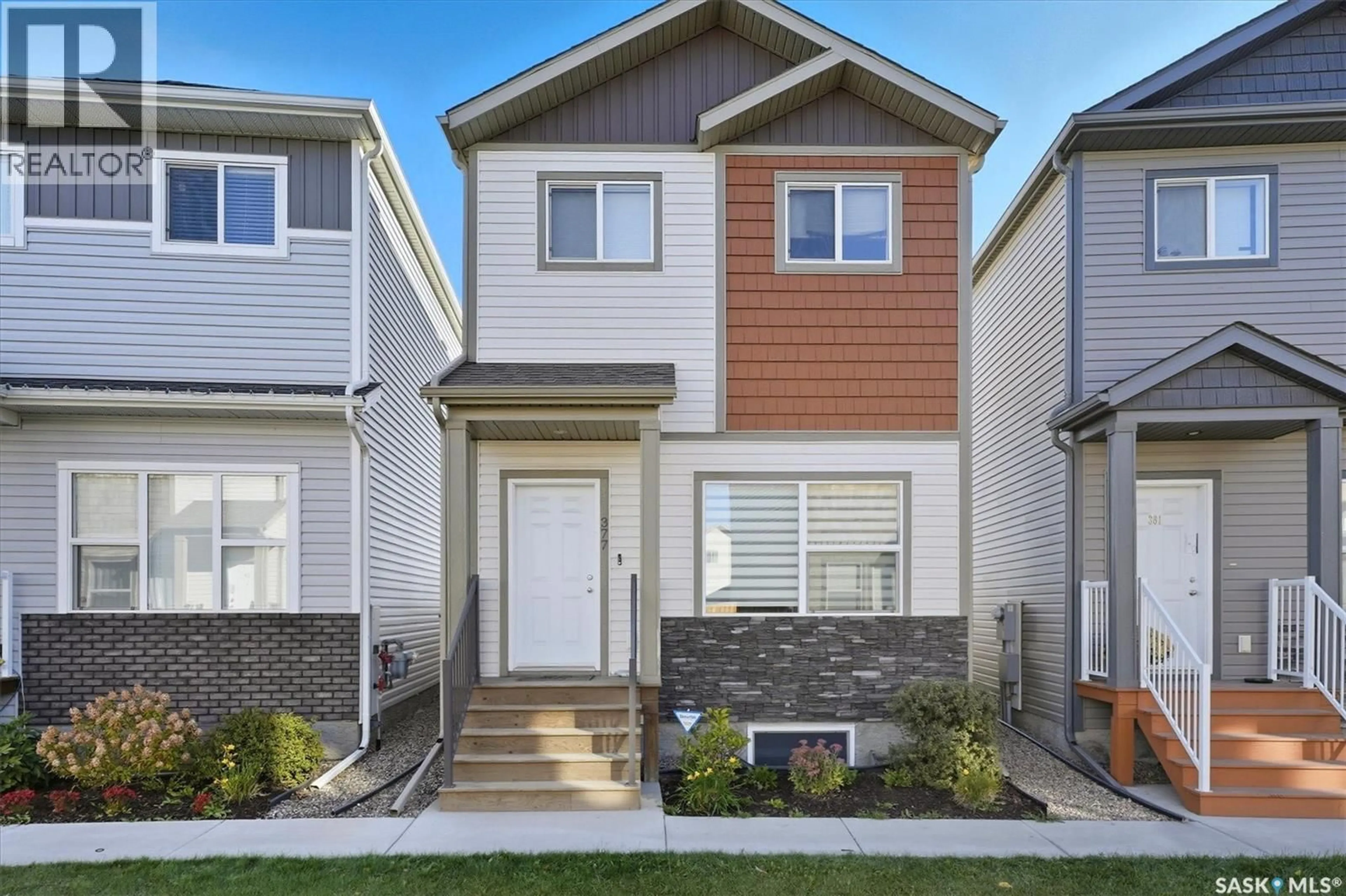 Home with vinyl exterior material, street for 377 1615 RICHARDSON ROAD, Saskatoon Saskatchewan S7R0M7