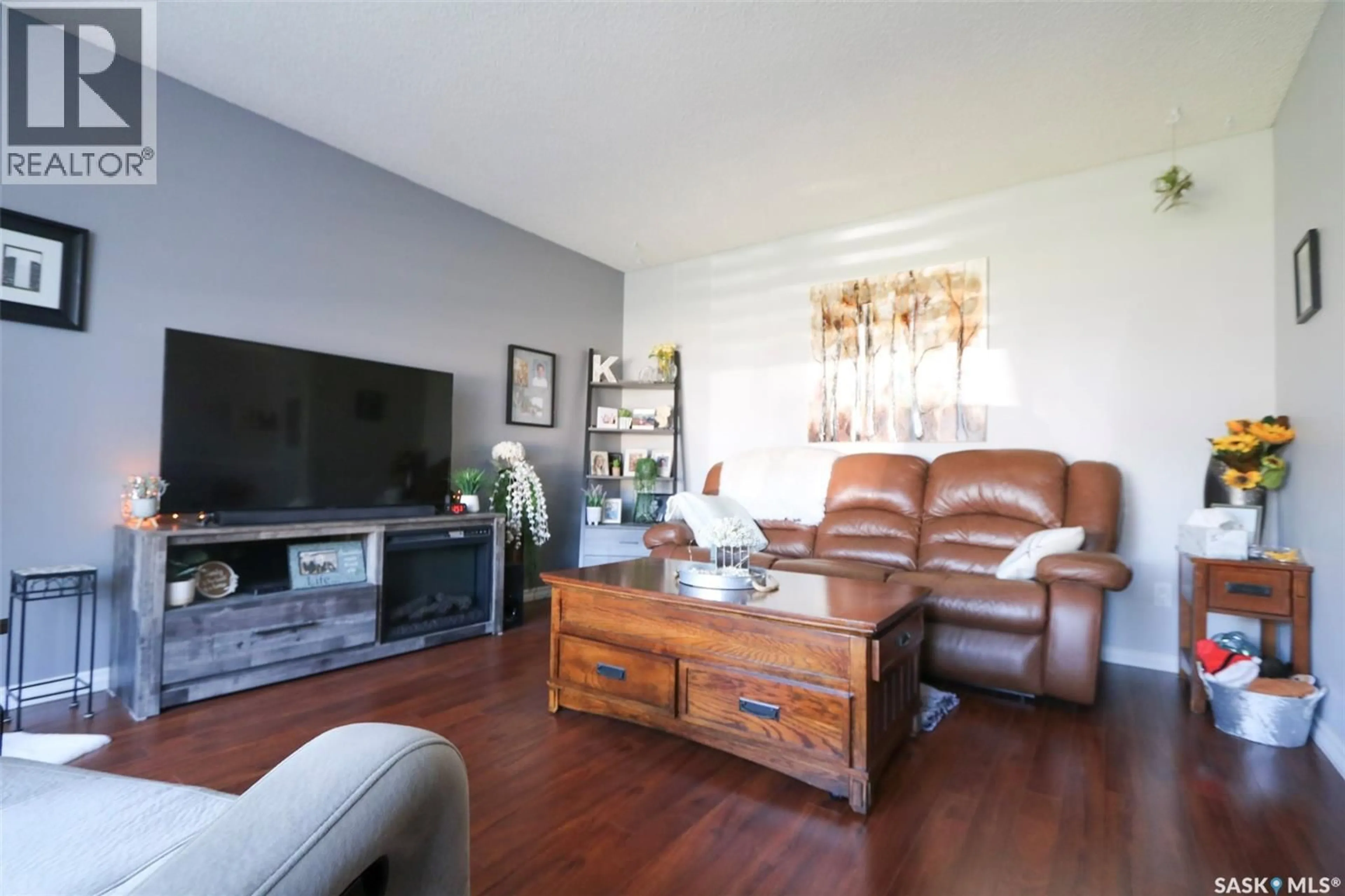 Living room with furniture, wood/laminate floor for 76 MORRISON DRIVE, Yorkton Saskatchewan S3N3Y2