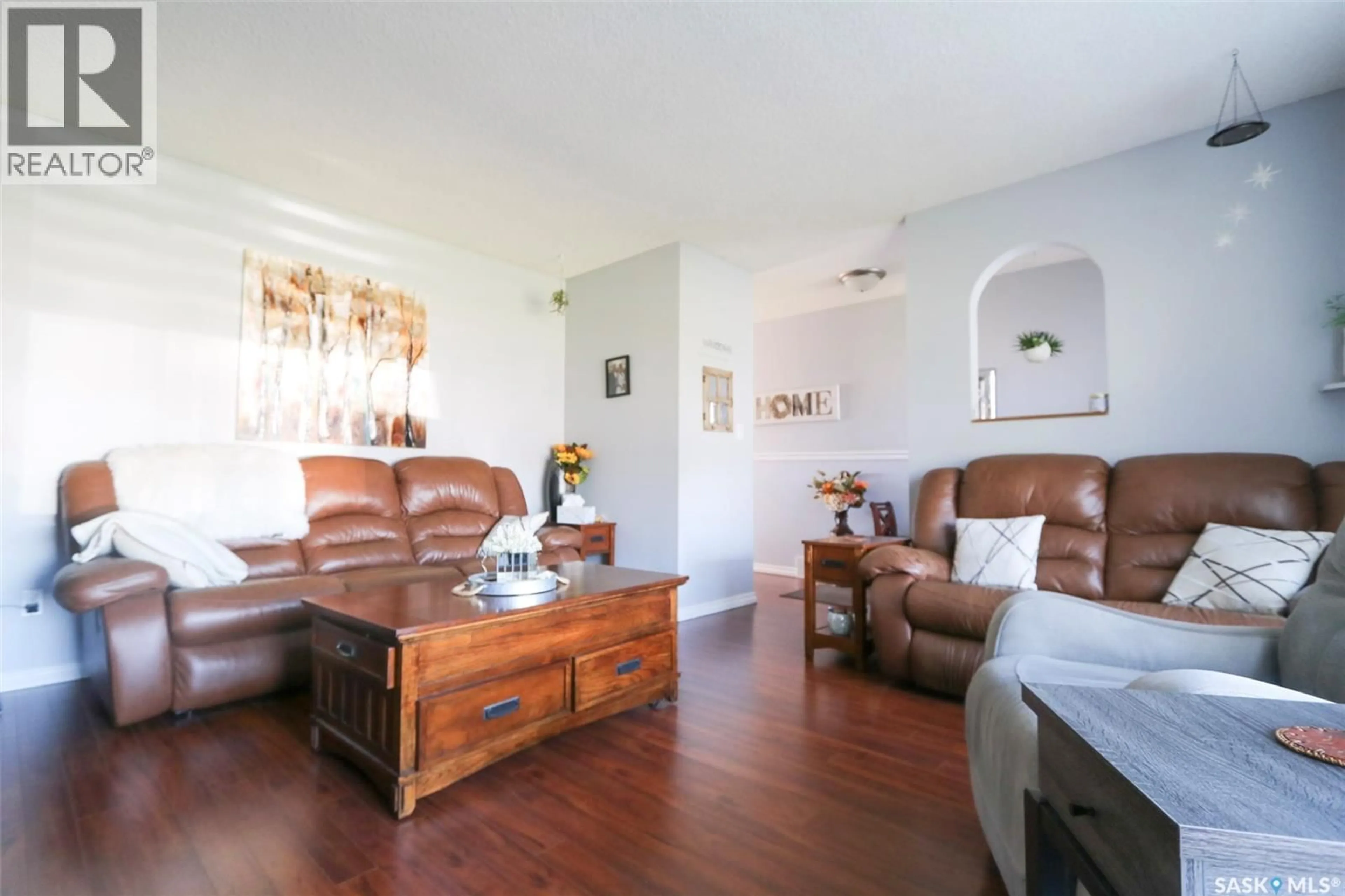 Living room with furniture, wood/laminate floor for 76 MORRISON DRIVE, Yorkton Saskatchewan S3N3Y2