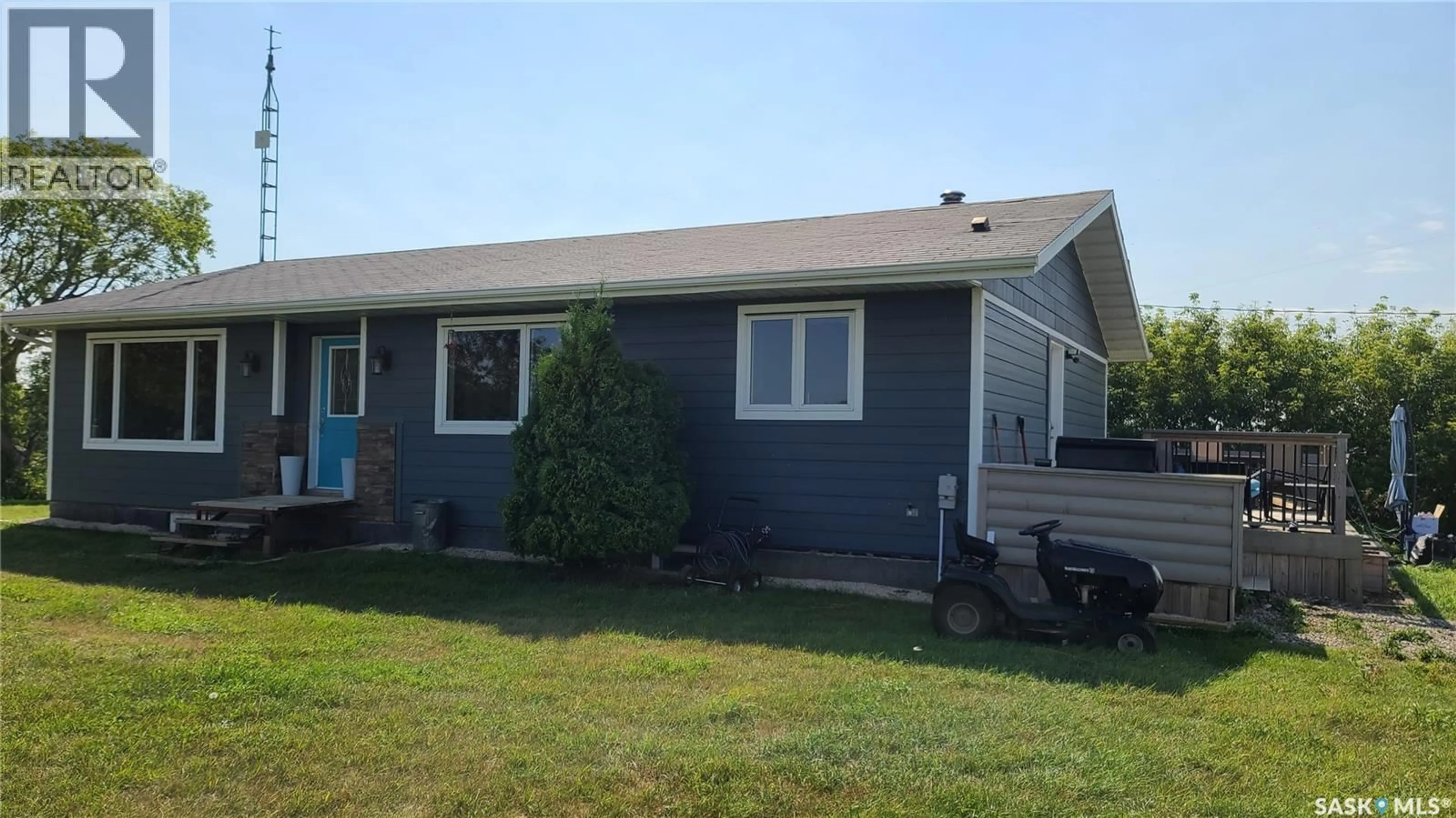 Home with vinyl exterior material, street for COUNTRY ACRES ACREAGE, Fertile Belt Rm No. 183 Saskatchewan S0A0X0