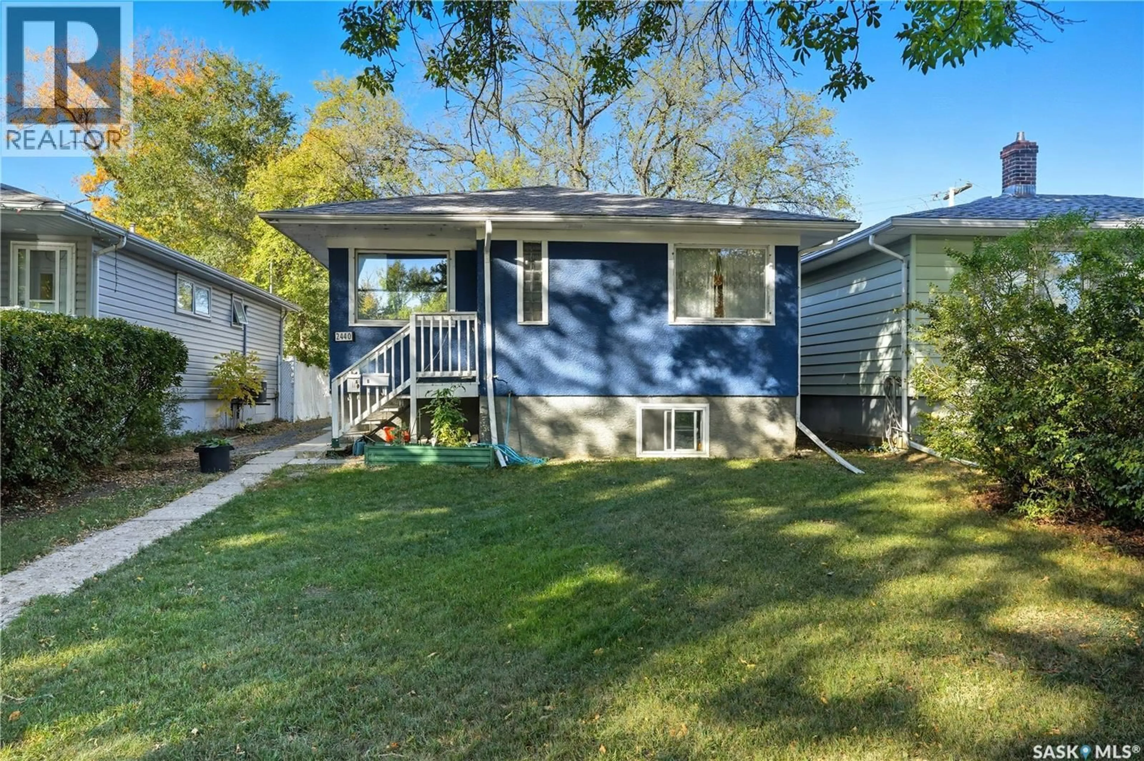 Home with vinyl exterior material, street for 2440 MCARA STREET, Regina Saskatchewan S4N2W5