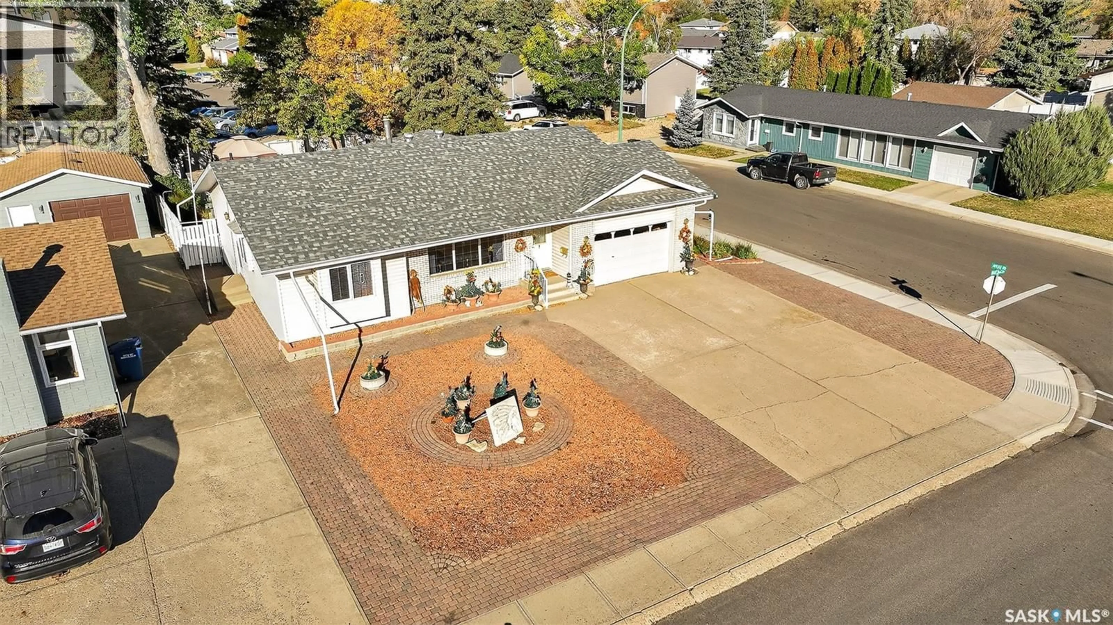 A pic from outside/outdoor area/front of a property/back of a property/a pic from drone, street for 18 BLUE SAGE DRIVE, Moose Jaw Saskatchewan S6J1C4