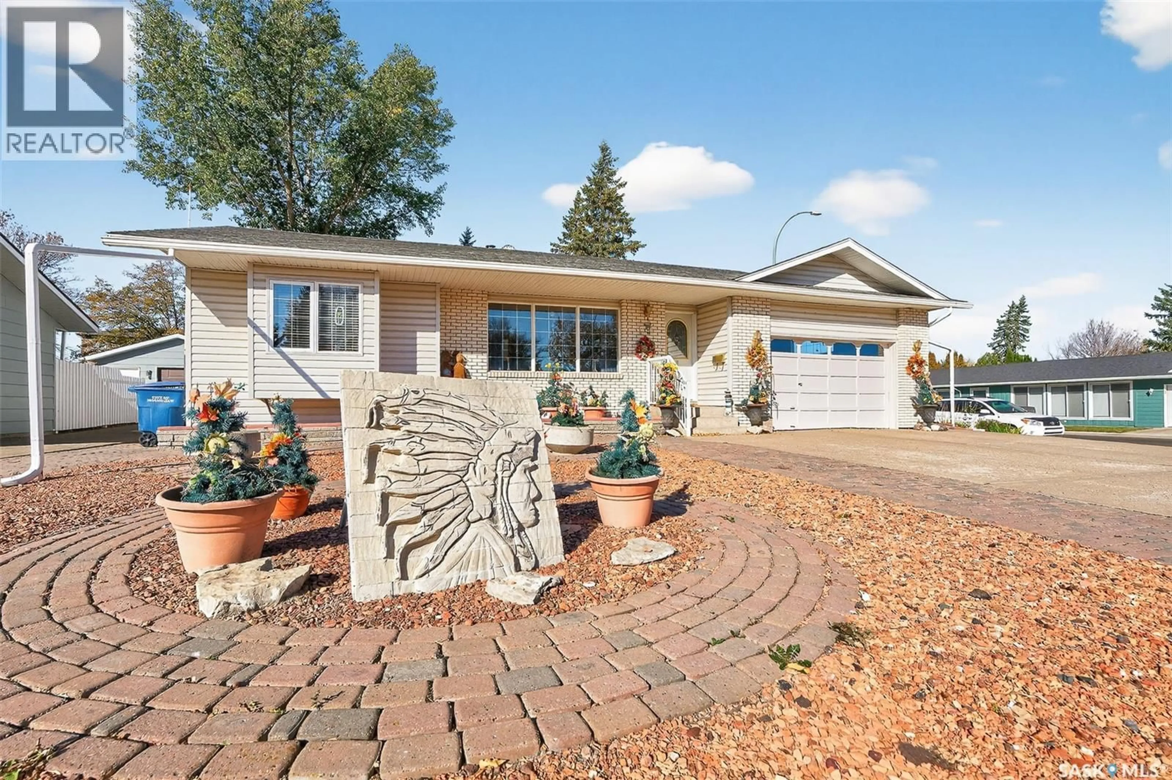 Home with brick exterior material, street for 18 BLUE SAGE DRIVE, Moose Jaw Saskatchewan S6J1C4