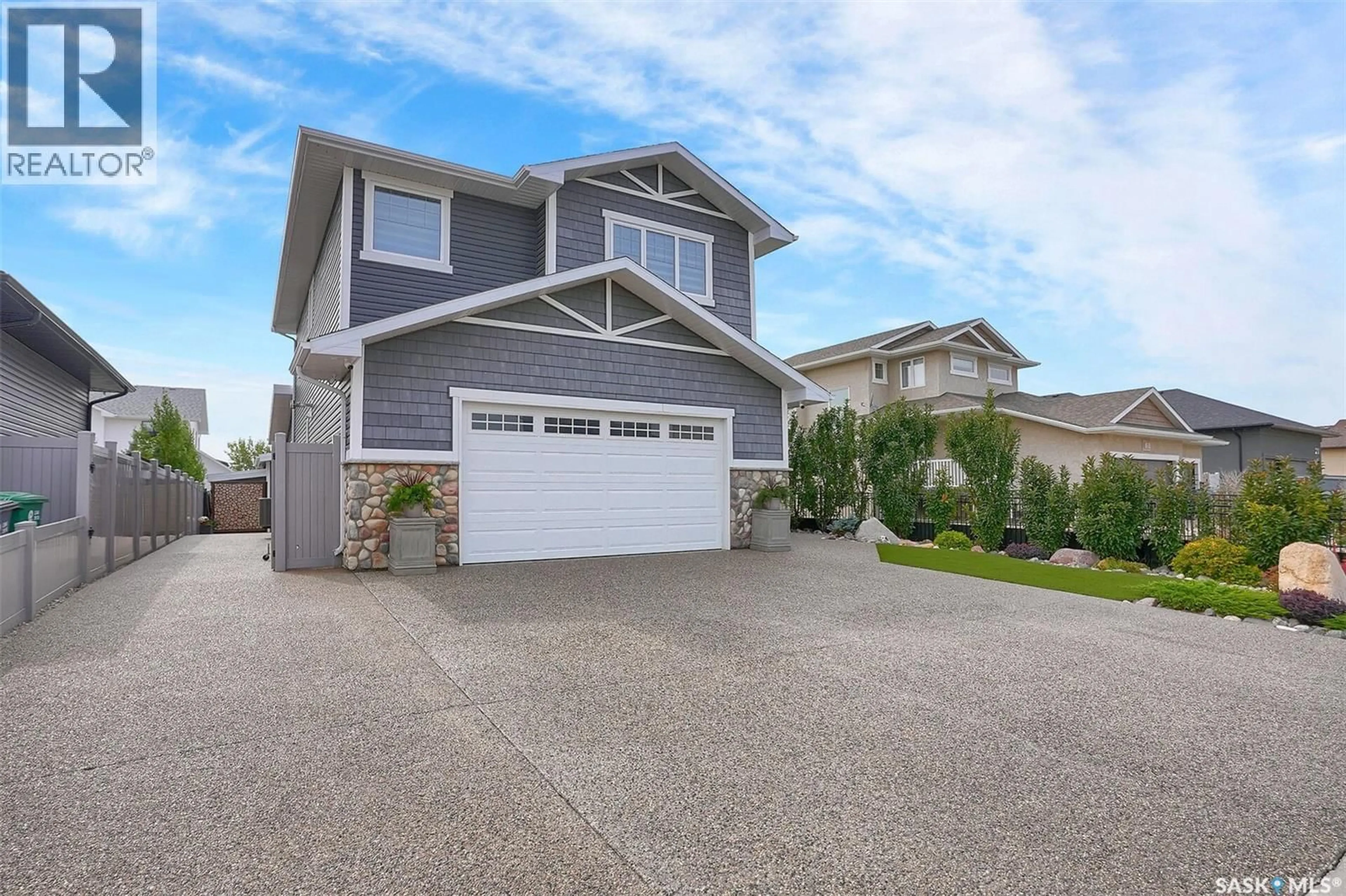 Home with vinyl exterior material, street for 25 HUDSON DRIVE, Pilot Butte Saskatchewan S0G3Z0