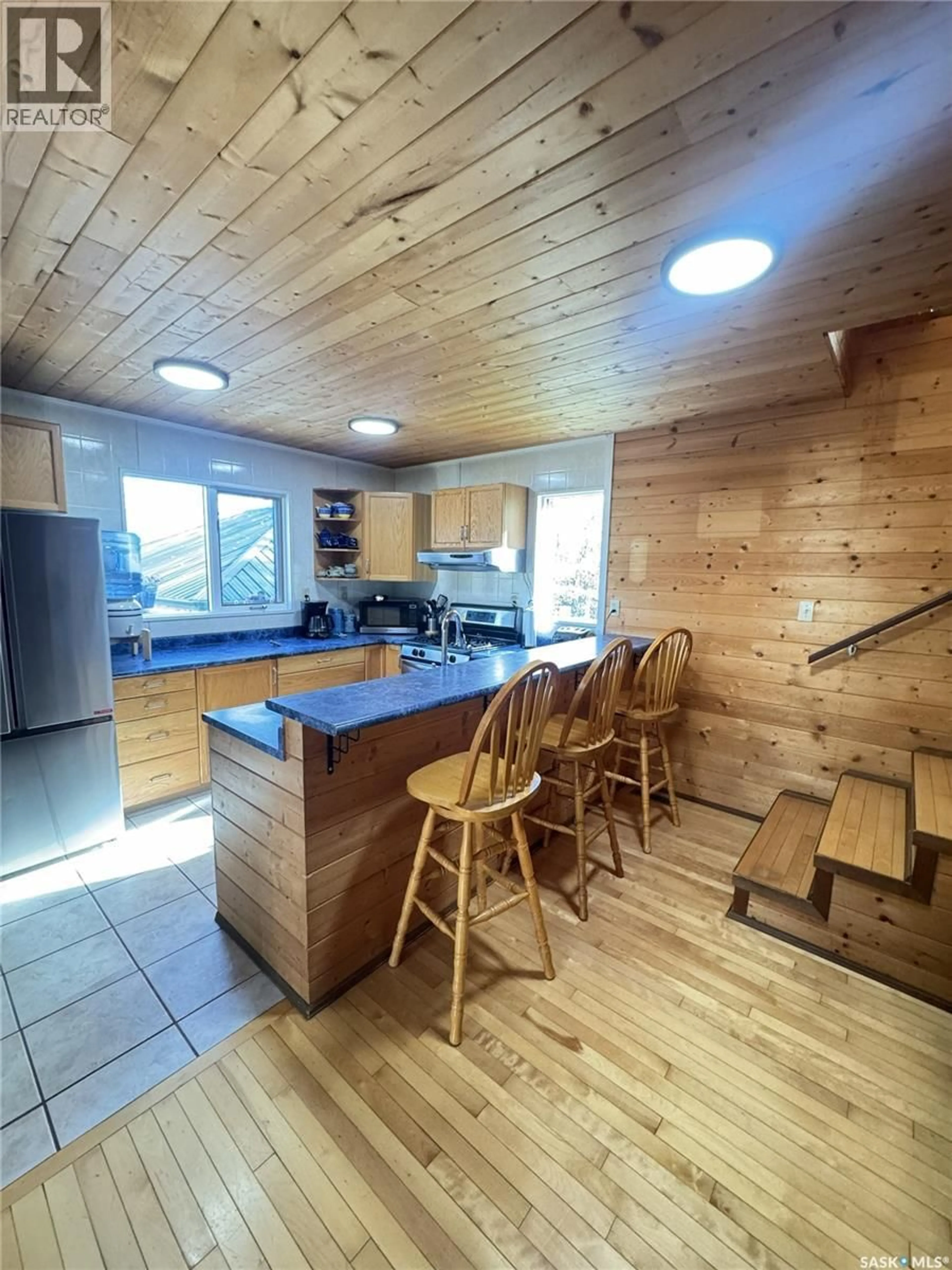 Open concept kitchen, wood/laminate floor for 140 CARWIN PARK, Lakeland Rm No. 521 Saskatchewan S0J0N0