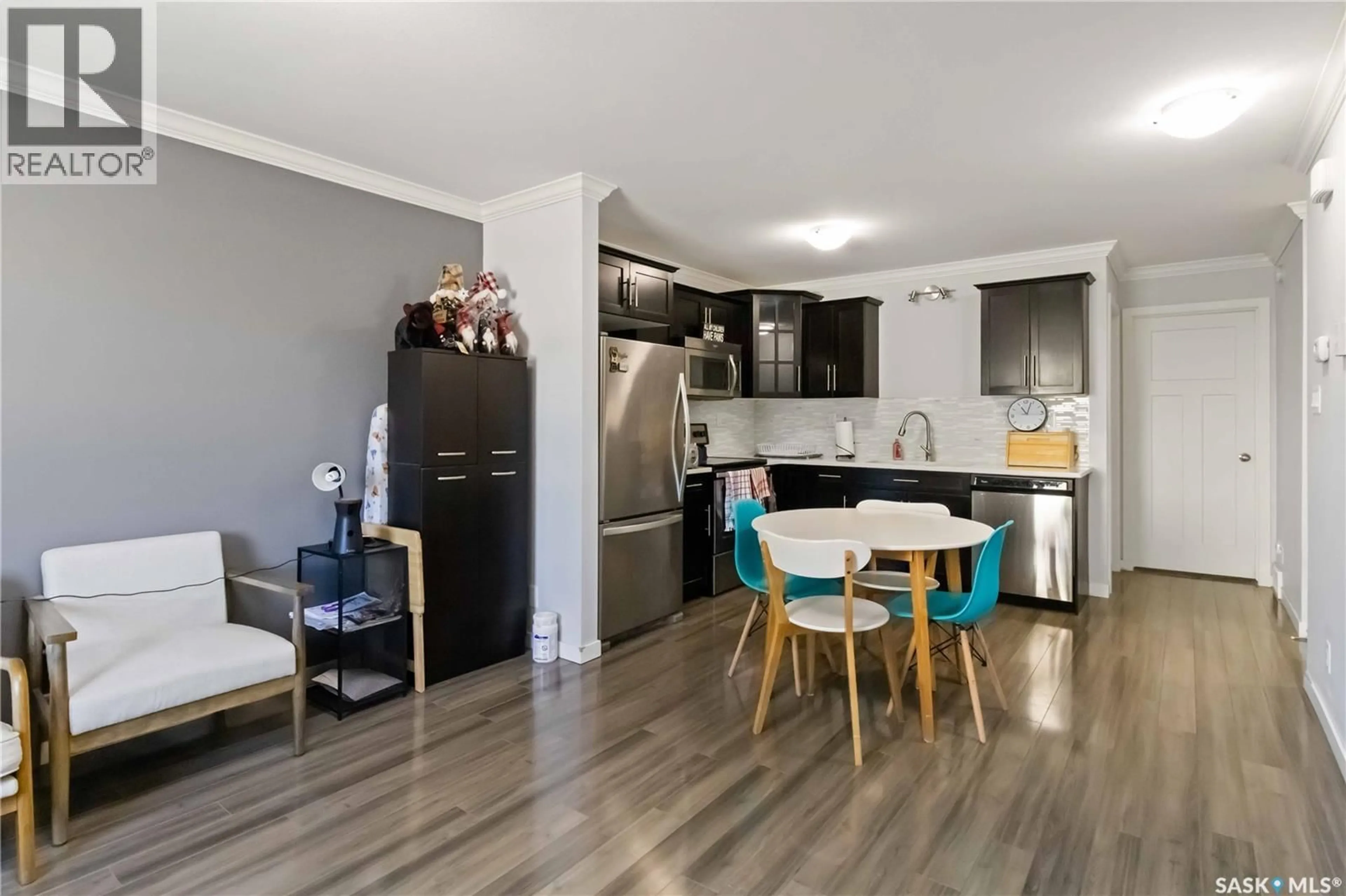 Open concept kitchen, wood/laminate floor for 250 - 254 AKHTAR BEND, Saskatoon Saskatchewan S7W0W4