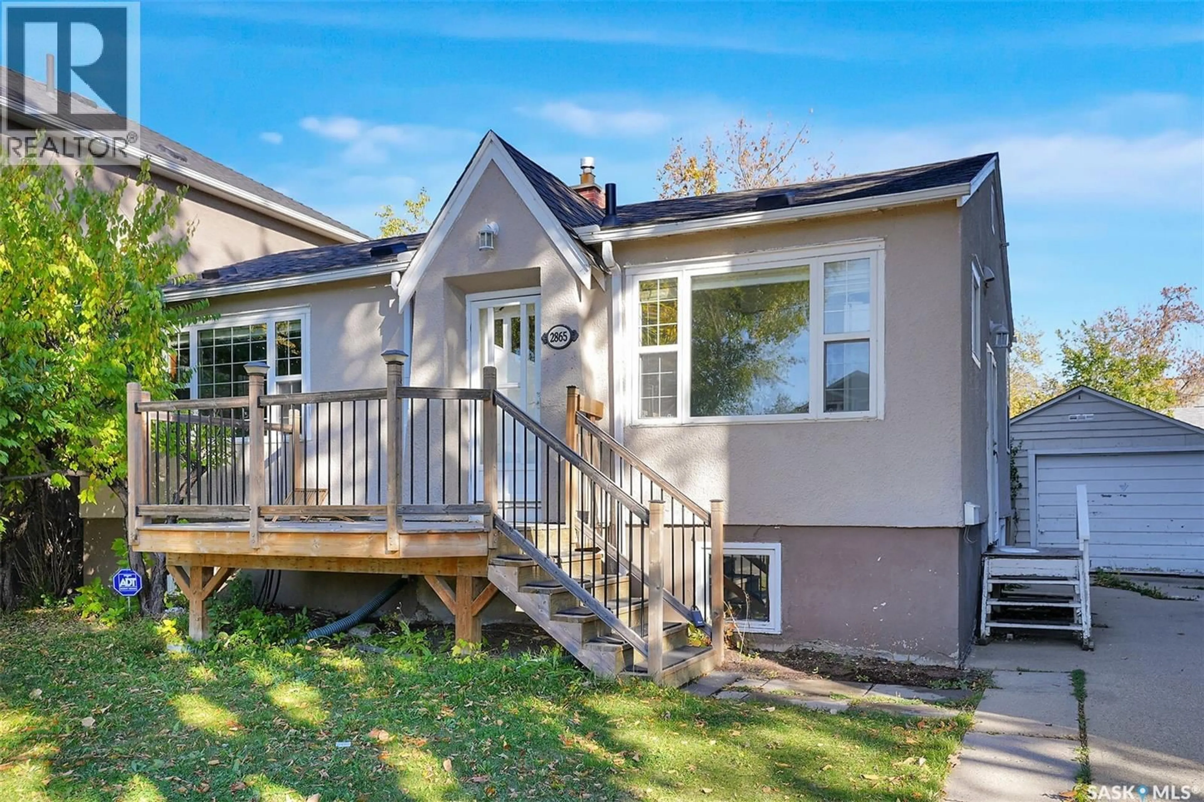 Home with vinyl exterior material, street for 2865 GARNET STREET, Regina Saskatchewan S4S1X1