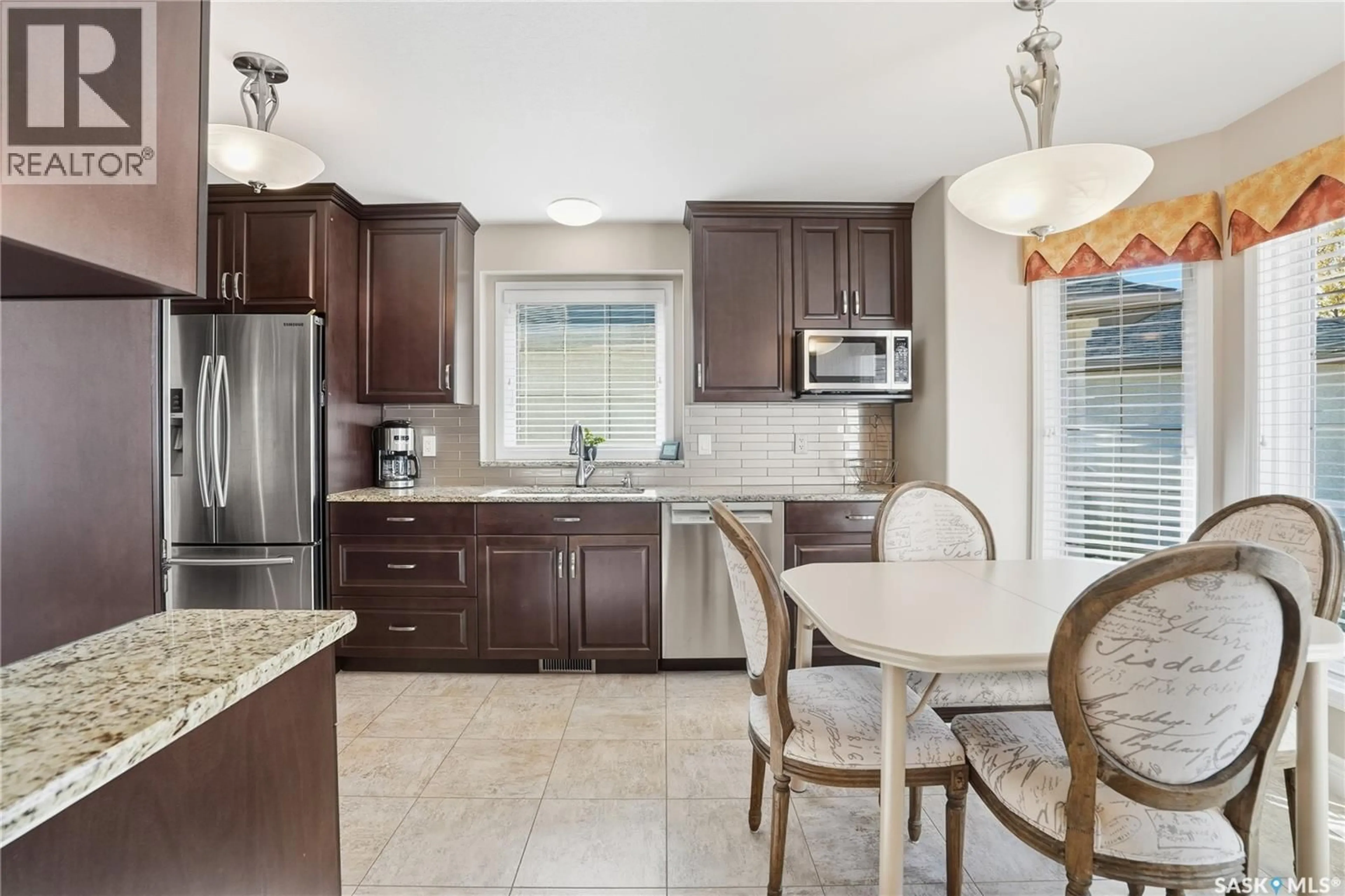 Open concept kitchen, ceramic/tile floor for 330 - 30 STODOLA COURT, Saskatoon Saskatchewan S7N4N5