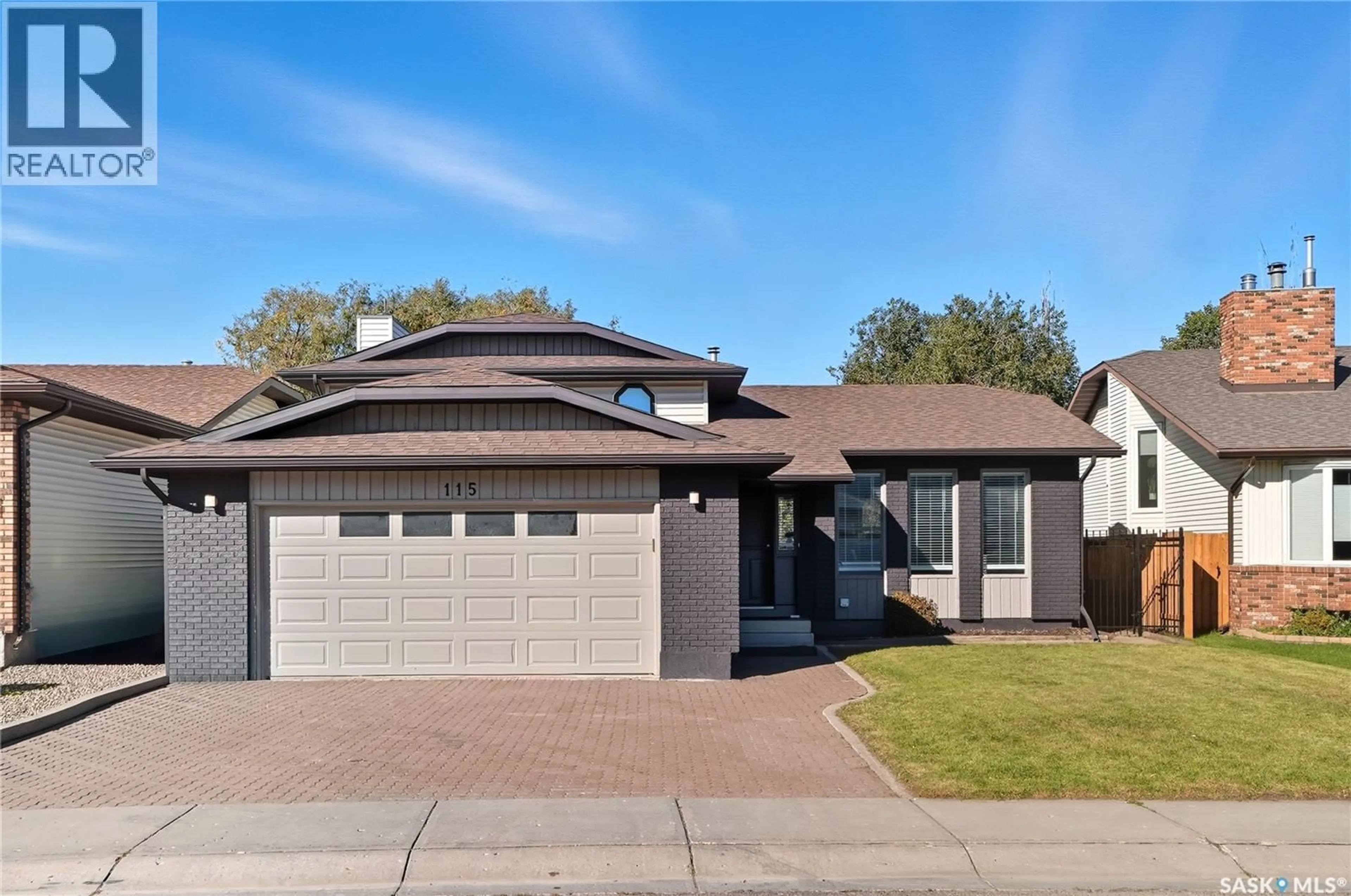 Home with brick exterior material, street for 115 SMOOTHSTONE CRESCENT, Saskatoon Saskatchewan S7J4T1