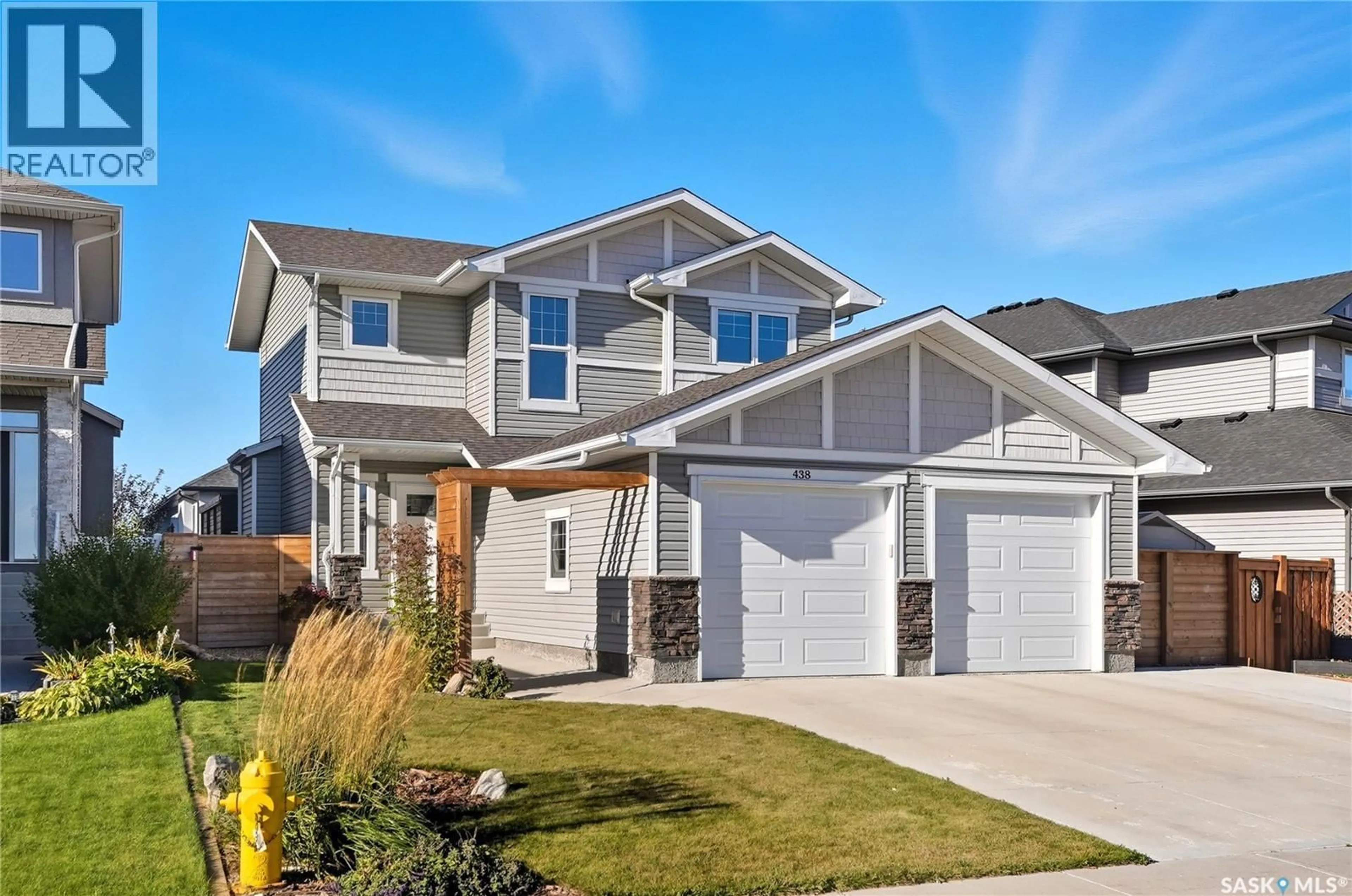 Home with vinyl exterior material, street for 438 FLYNN LANE, Saskatoon Saskatchewan S7V0A7
