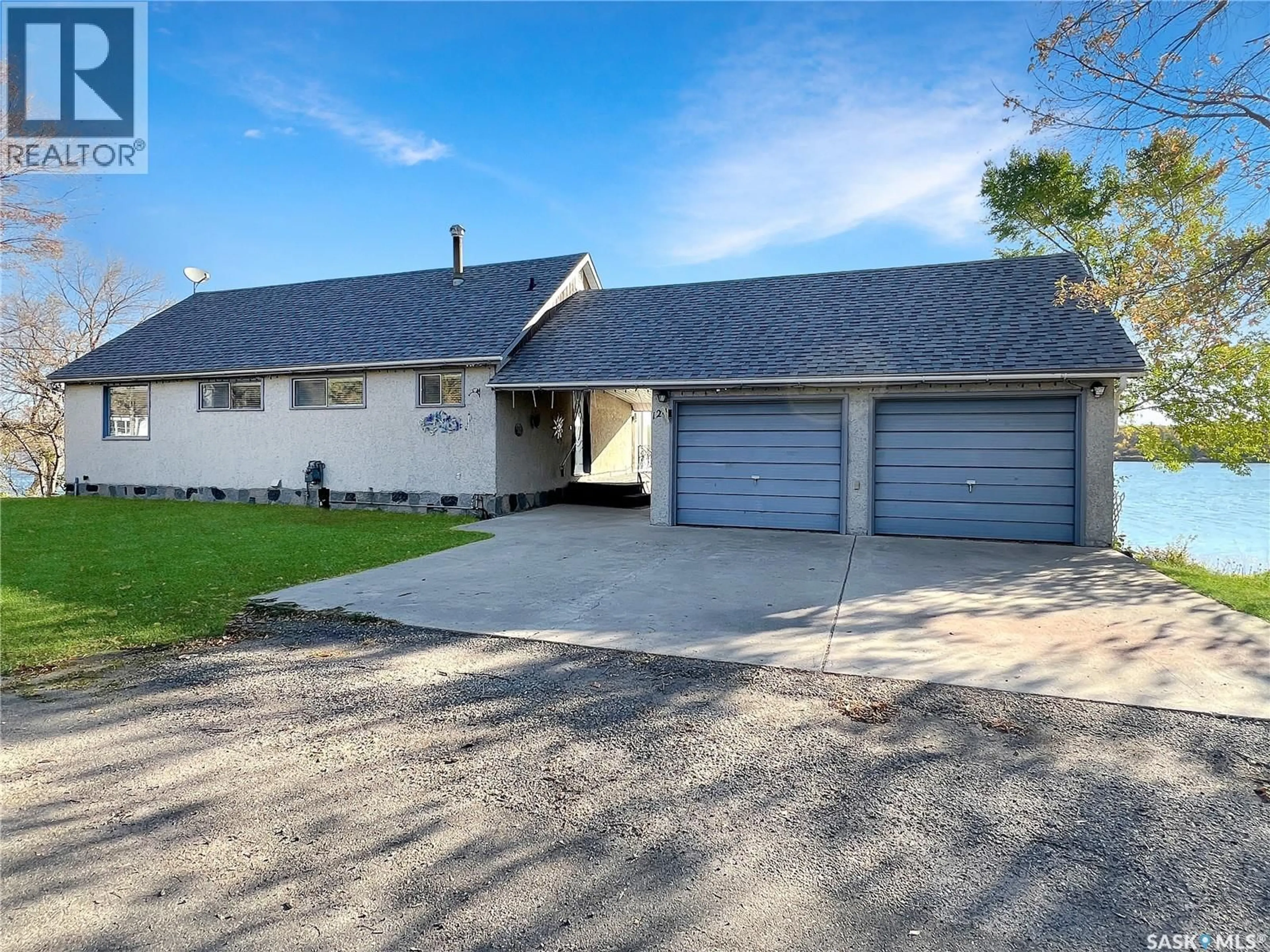 Home with vinyl exterior material, street for 124 CRESCENT LAKE ROAD, Saltcoats Saskatchewan S0A3R0