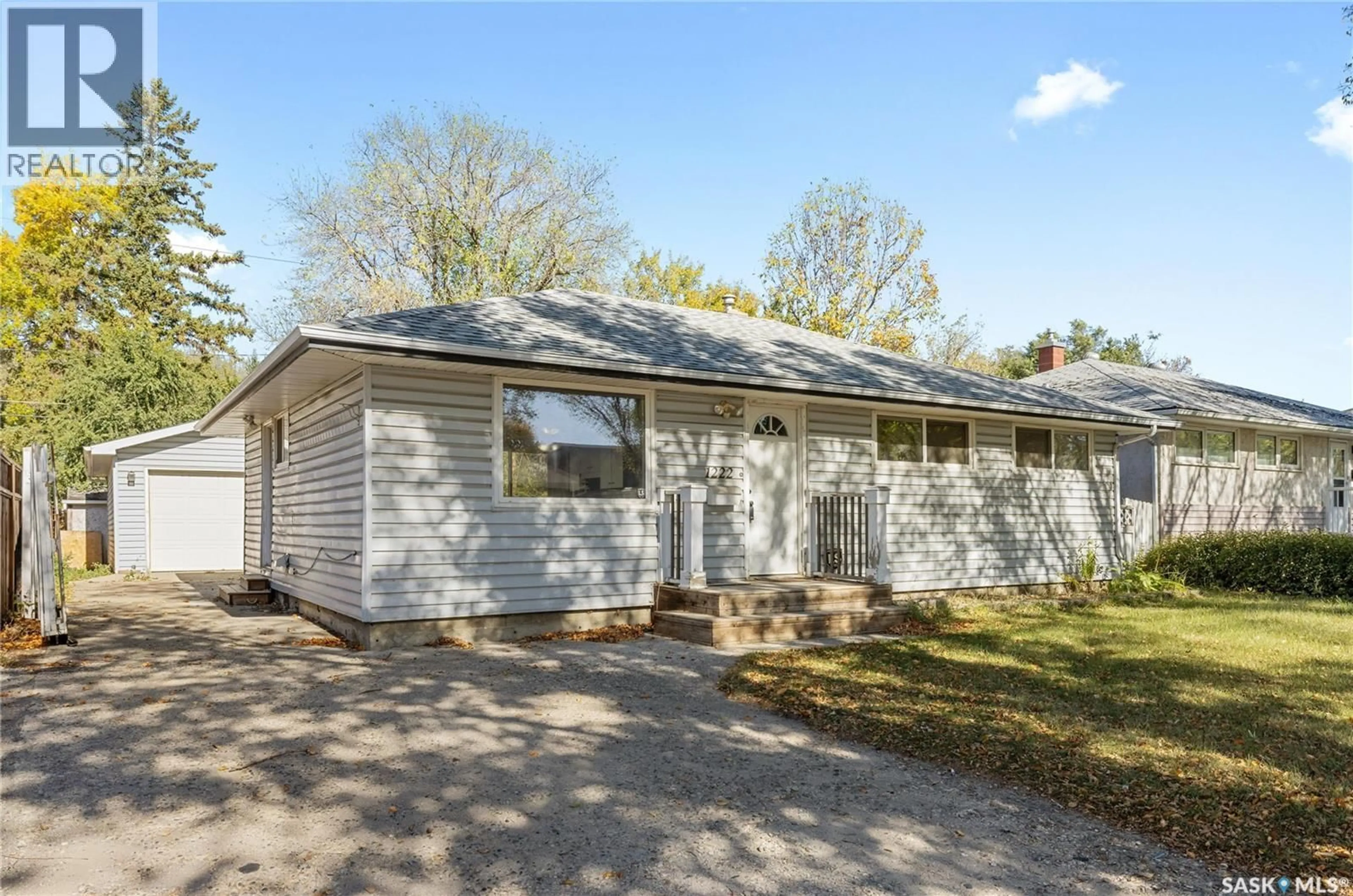 Home with vinyl exterior material, street for 1222 7TH AVENUE, Regina Saskatchewan S4R0H4