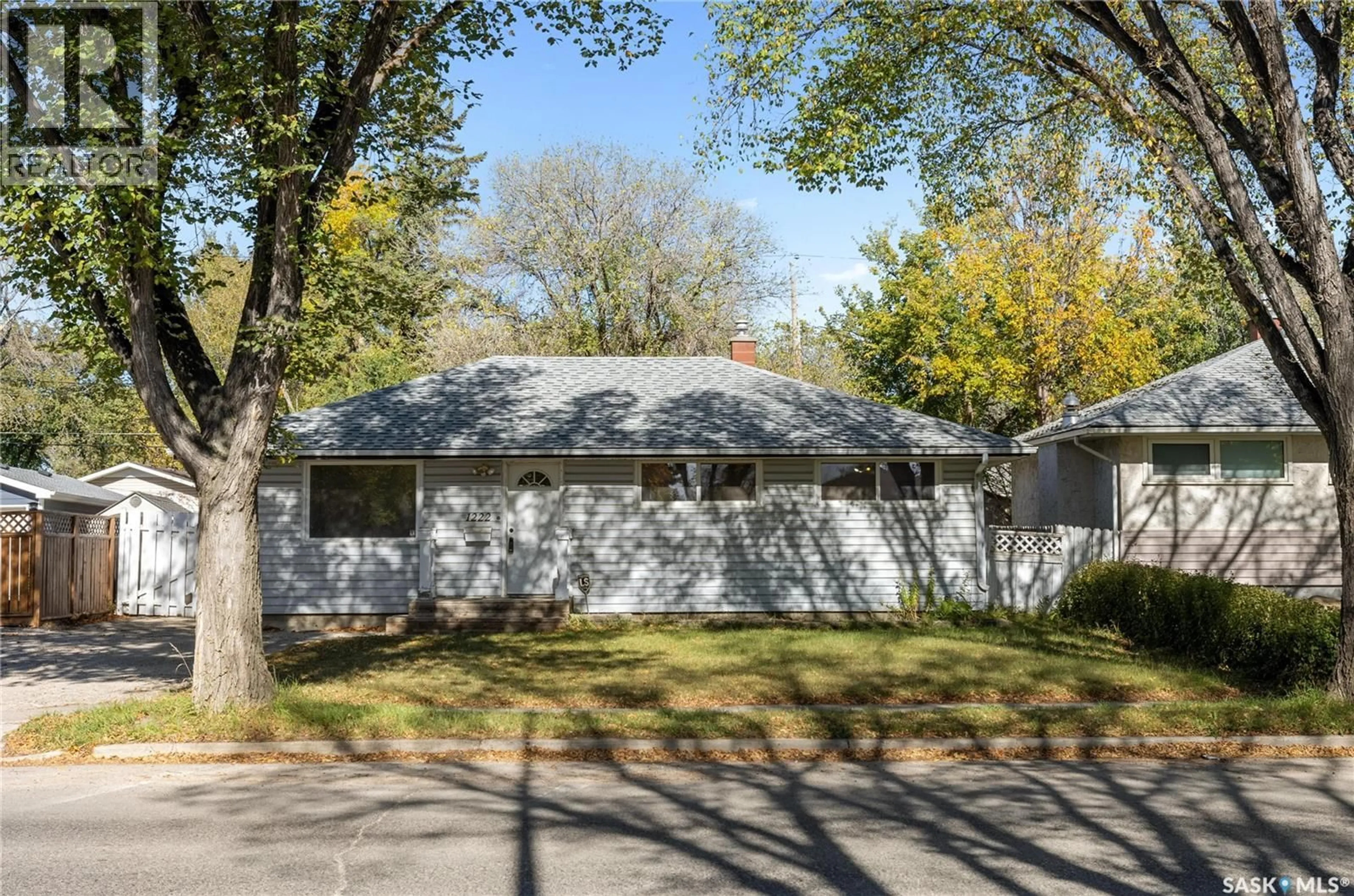 Home with vinyl exterior material, street for 1222 7TH AVENUE, Regina Saskatchewan S4R0H4