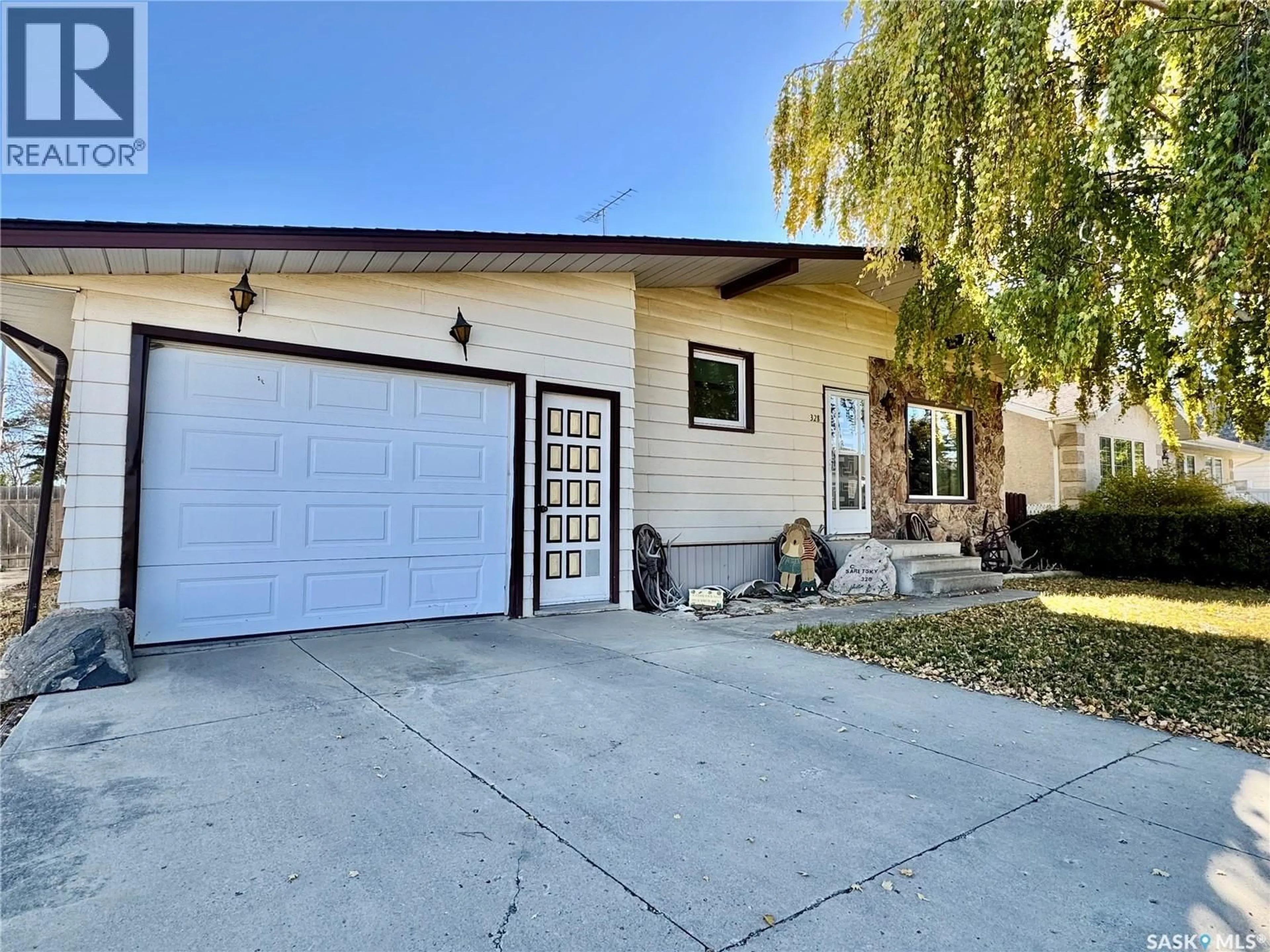 Home with vinyl exterior material, street for 328 7TH STREET, Humboldt Saskatchewan S0K2A0