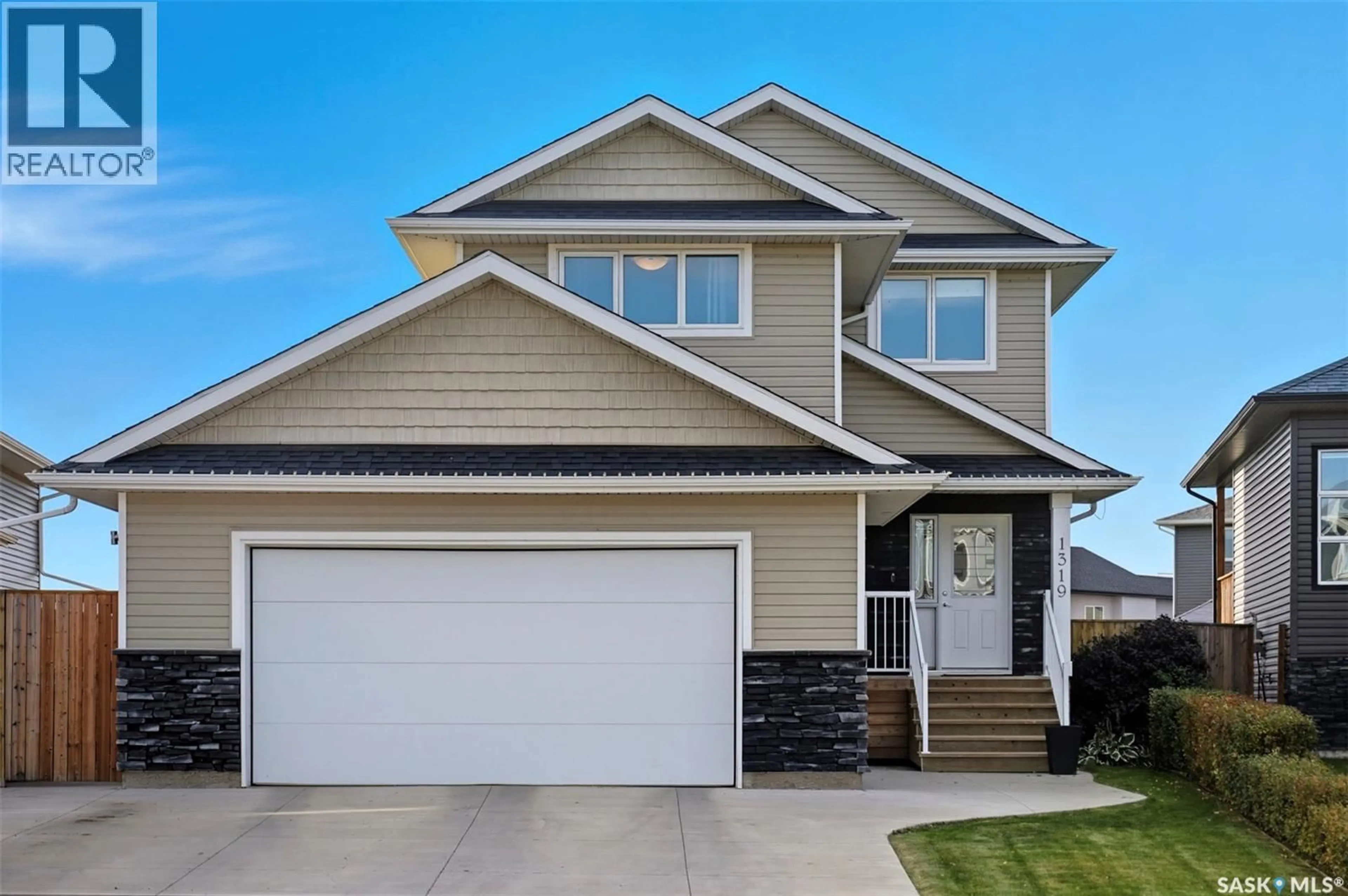 Home with vinyl exterior material, street for 1319 STEEVES AVENUE, Saskatoon Saskatchewan S7R0M4