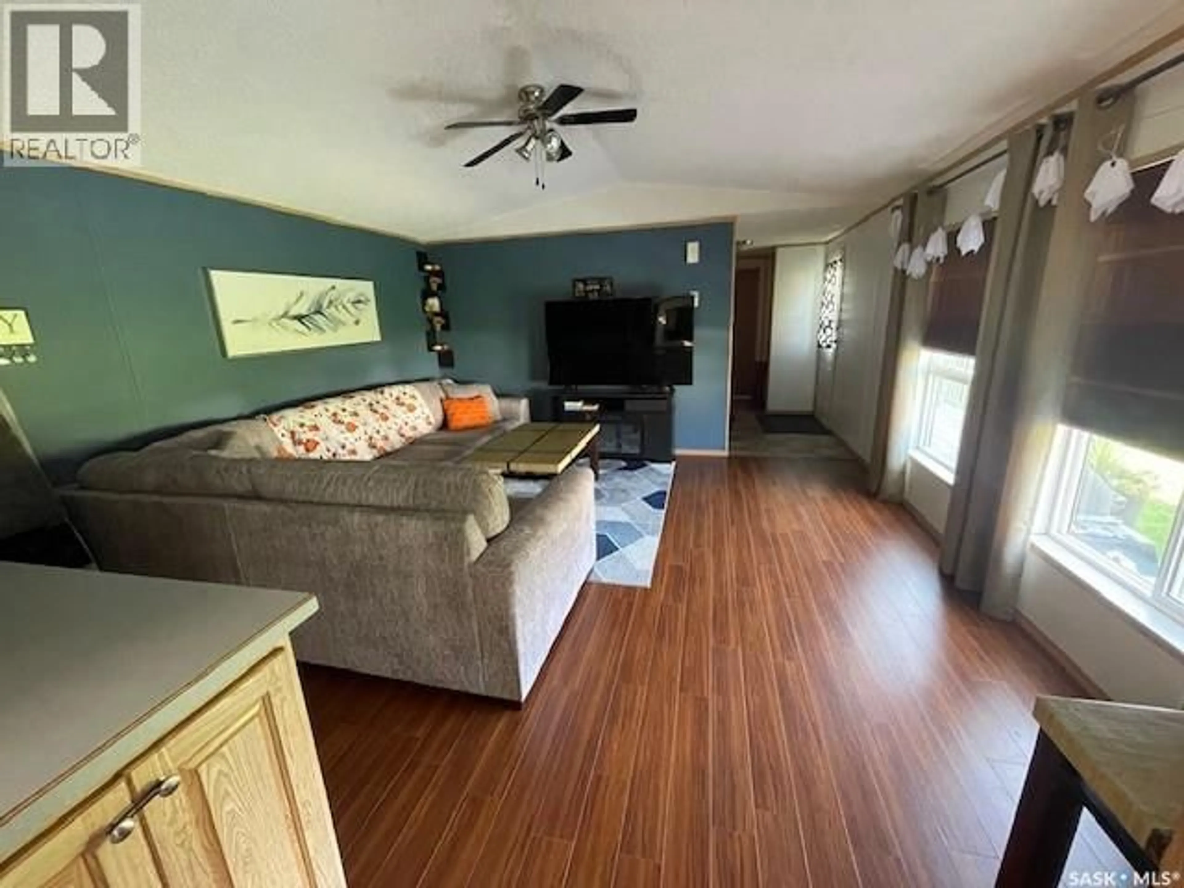 Living room with furniture, wood/laminate floor for 324 7TH STREET, Alameda Saskatchewan S0C0A0