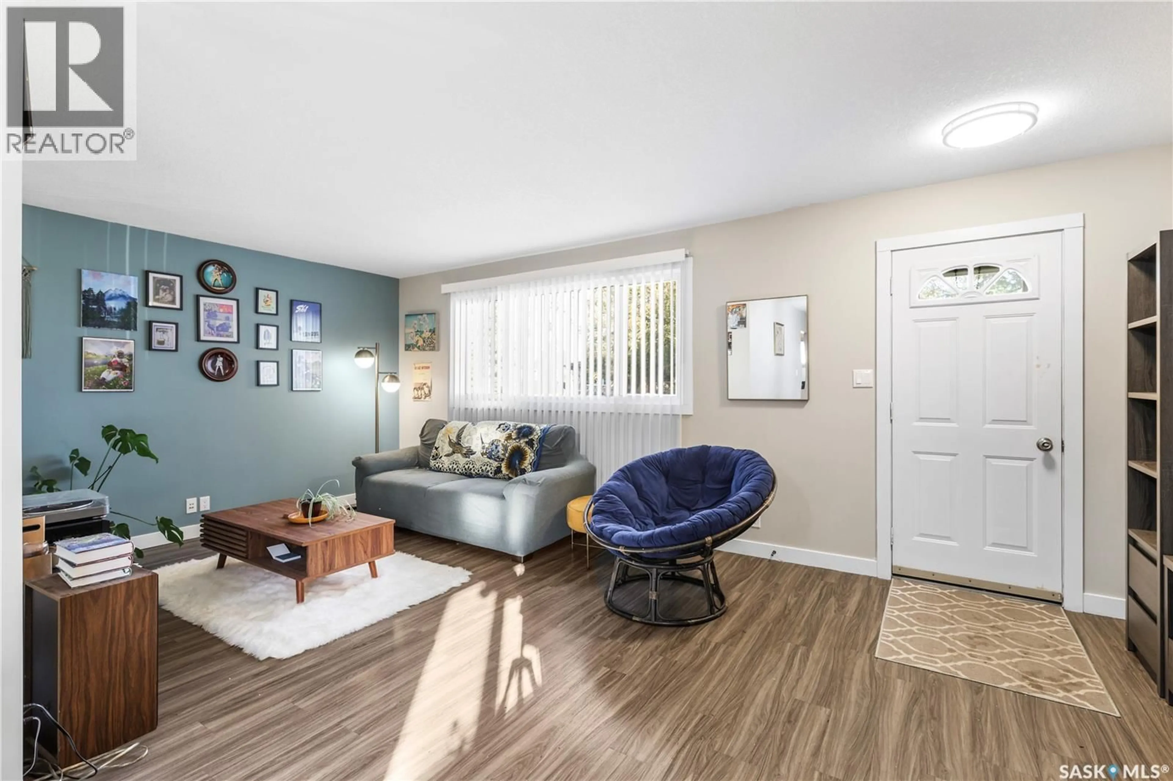 Living room with furniture, wood/laminate floor for 1940 YORK STREET, Regina Saskatchewan S4T4R4