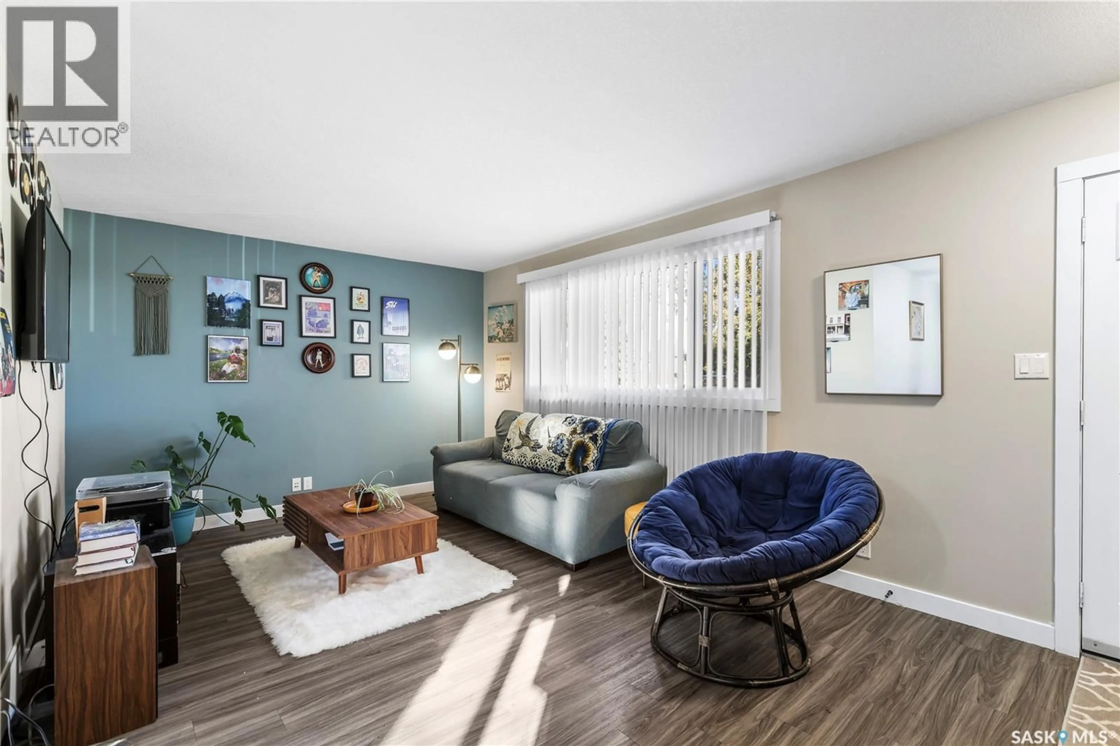 Living room with furniture, wood/laminate floor for 1940 YORK STREET, Regina Saskatchewan S4T4R4