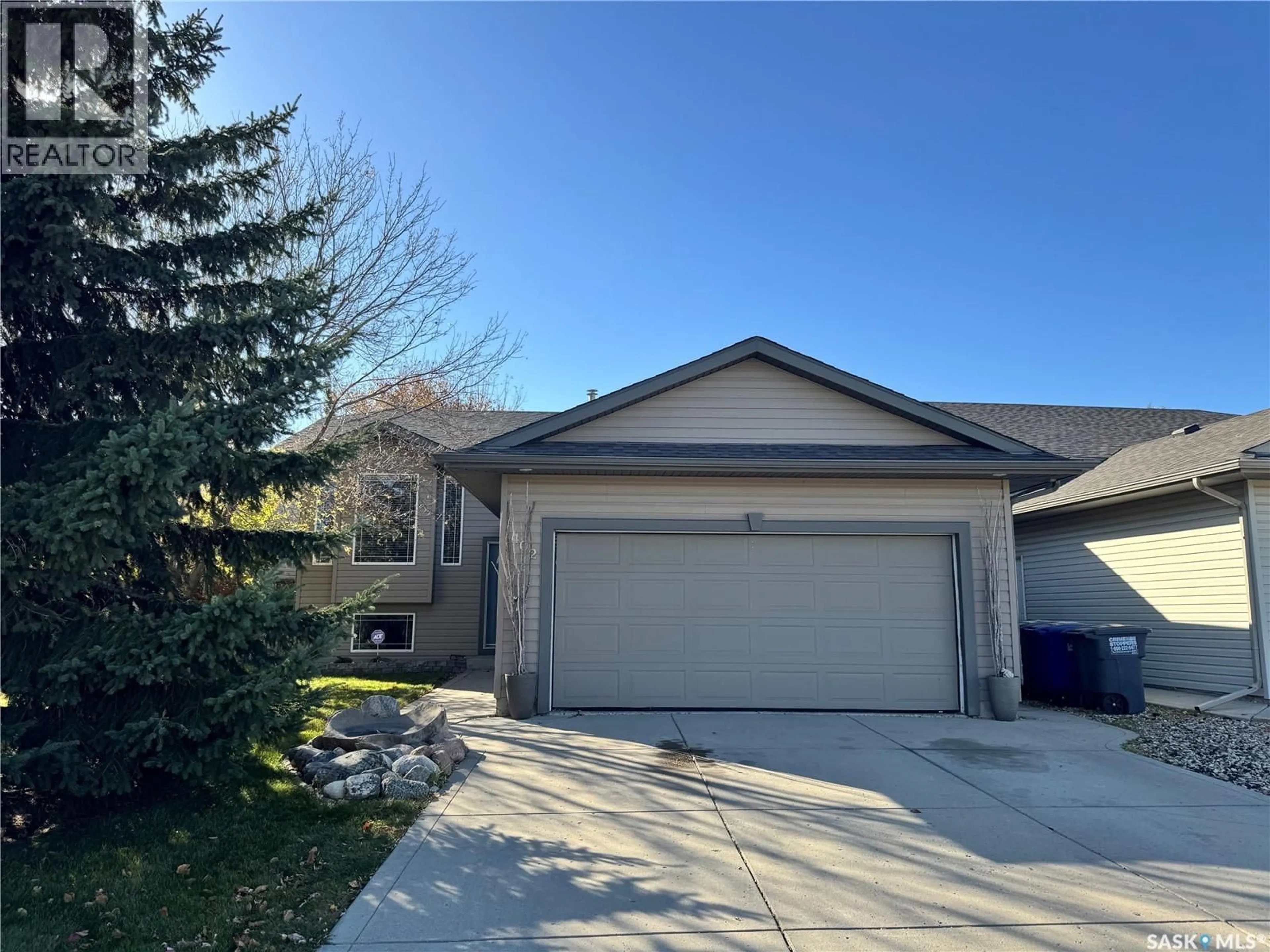 Home with vinyl exterior material, street for 402 OVERHOLT CRESCENT, Saskatoon Saskatchewan S7N4S9