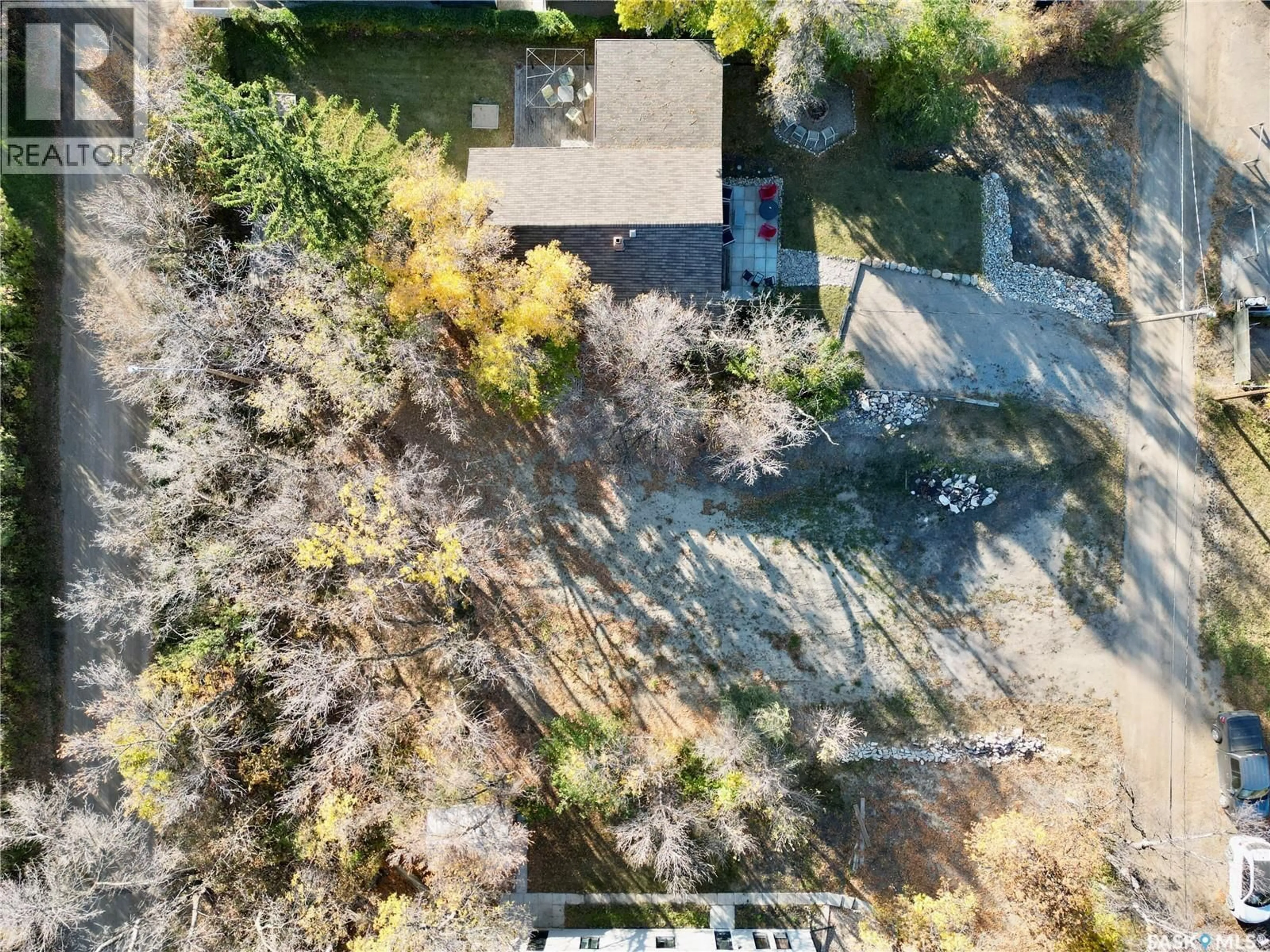 A pic from outside/outdoor area/front of a property/back of a property/a pic from drone, forest/trees view for 230 DALY AVENUE, Regina Beach Saskatchewan S0G4C0