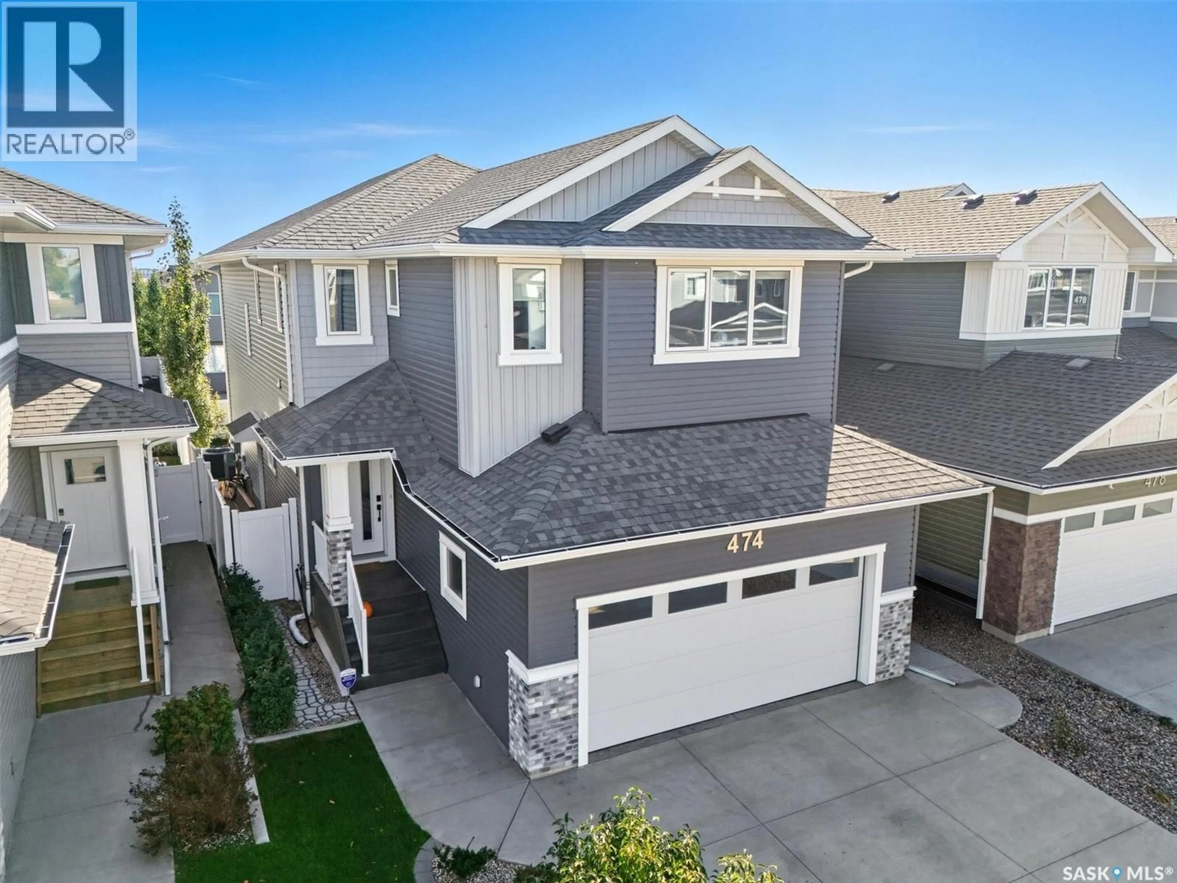 Home with vinyl exterior material, street for 474 MCFAULL CRESCENT, Saskatoon Saskatchewan S7V0T1