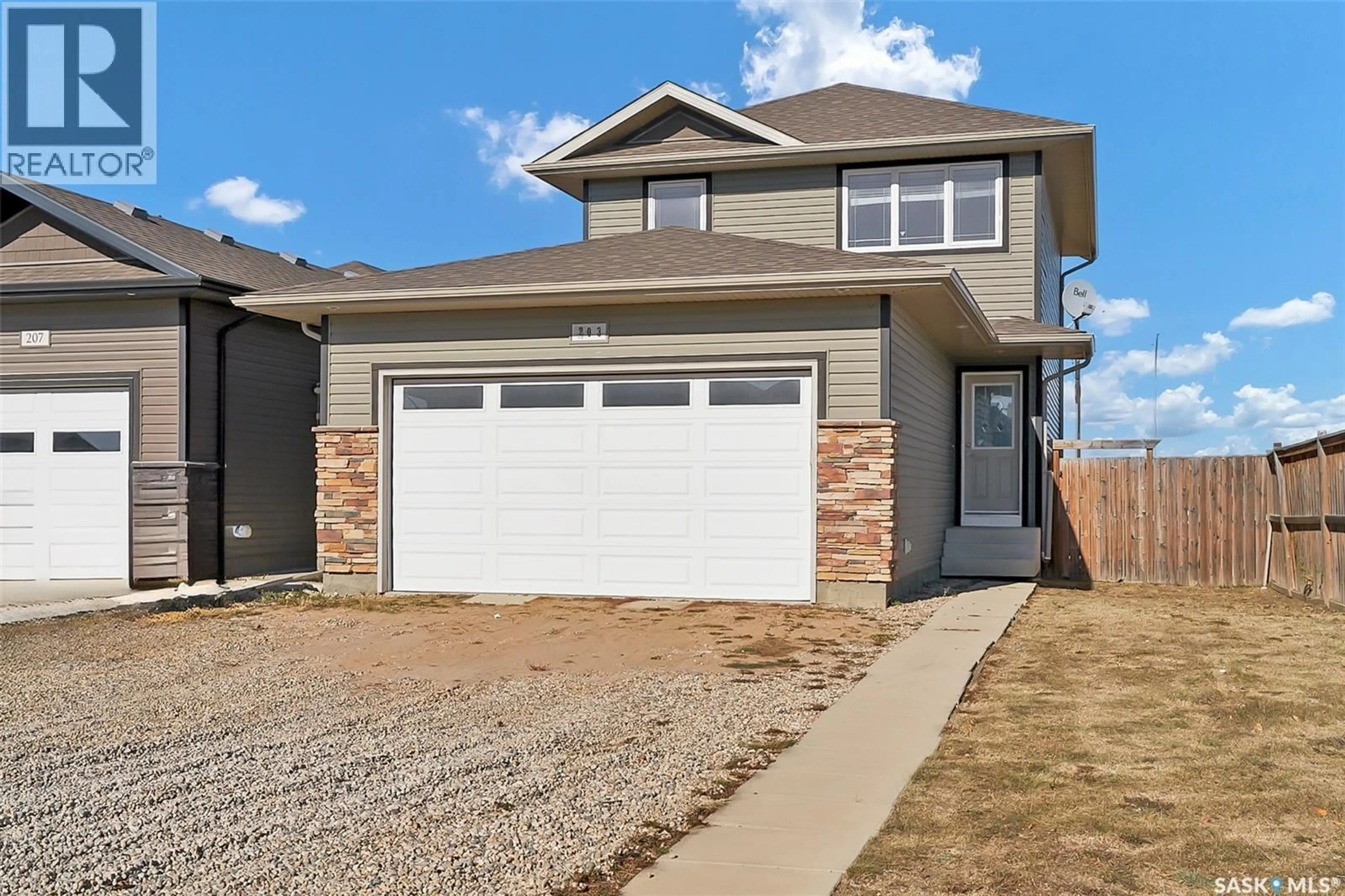 Home with vinyl exterior material, street for 203 HENICK CRESCENT, Saskatoon Saskatchewan S7R0J9