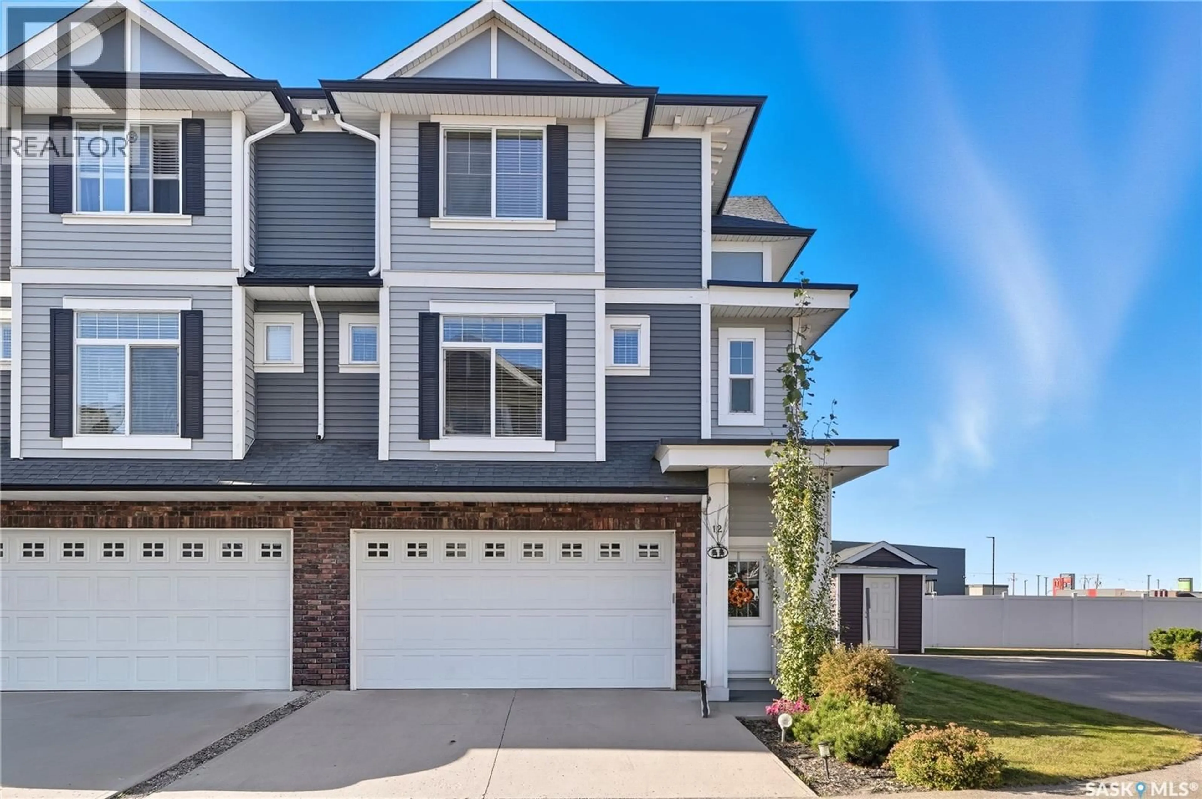 Home with vinyl exterior material, street for 12 425 LANGER PLACE, Warman Saskatchewan S0K4S1
