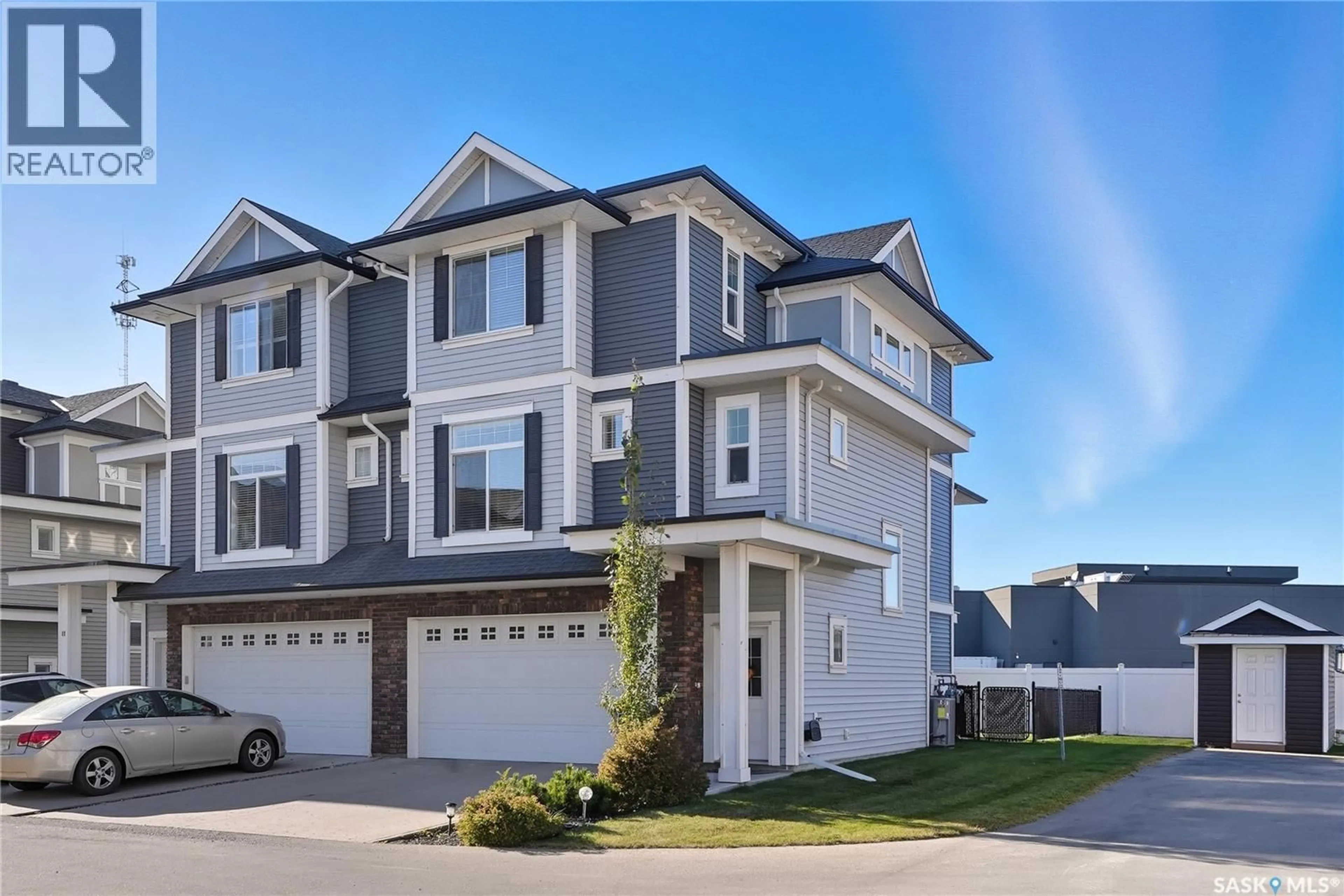Home with vinyl exterior material, street for 12 425 LANGER PLACE, Warman Saskatchewan S0K4S1