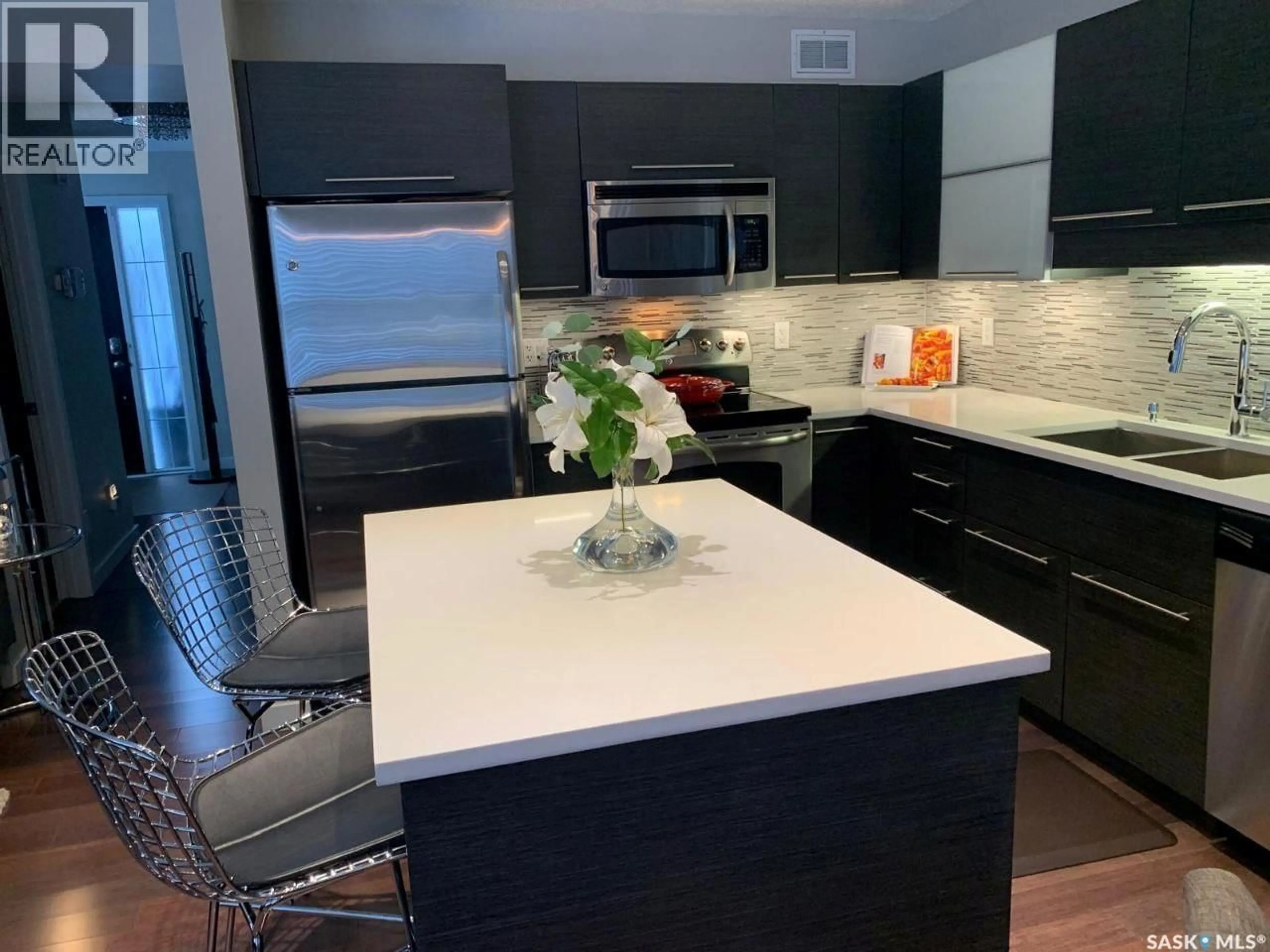 Open concept kitchen, ceramic/tile floor for 410 - 112 LEDINGHAM WAY, Saskatoon Saskatchewan S7V0C4