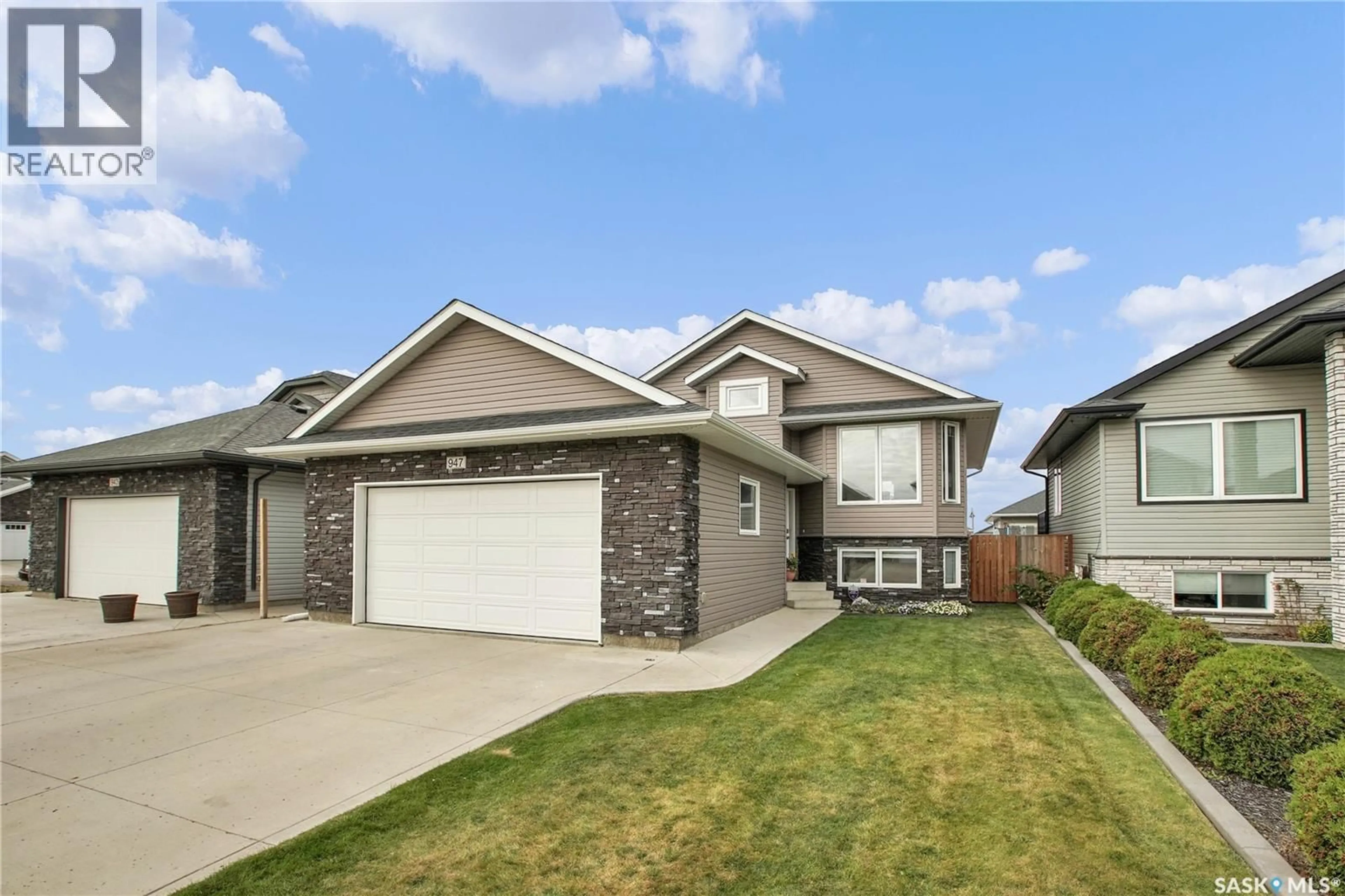 Home with brick exterior material, street for 947 PRINGLE COVE, Saskatoon Saskatchewan S7T0V6