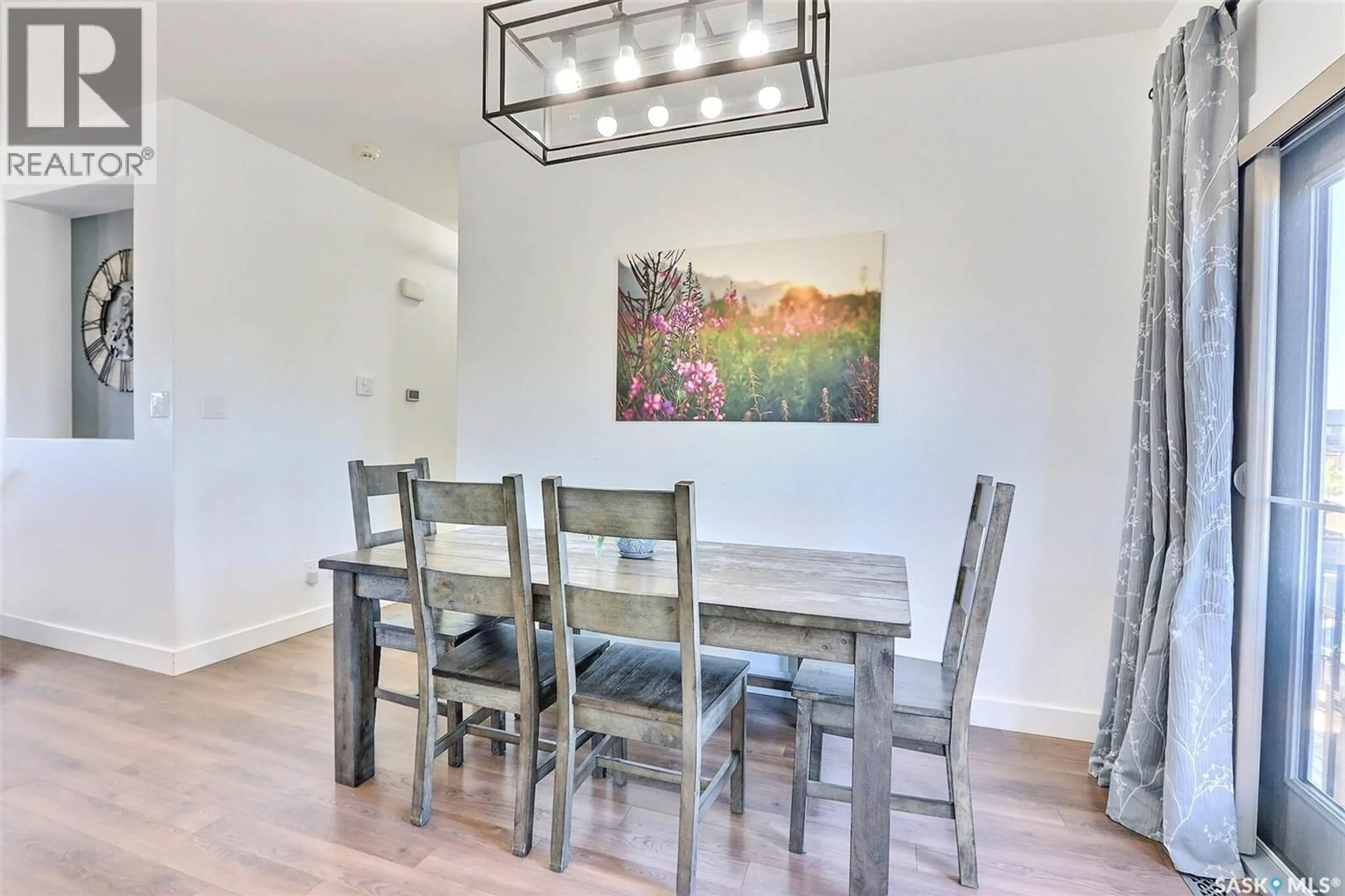 Dining room, wood/laminate floor for 1 BORROWMAN PLACE, Prince Albert Saskatchewan S6X0B1