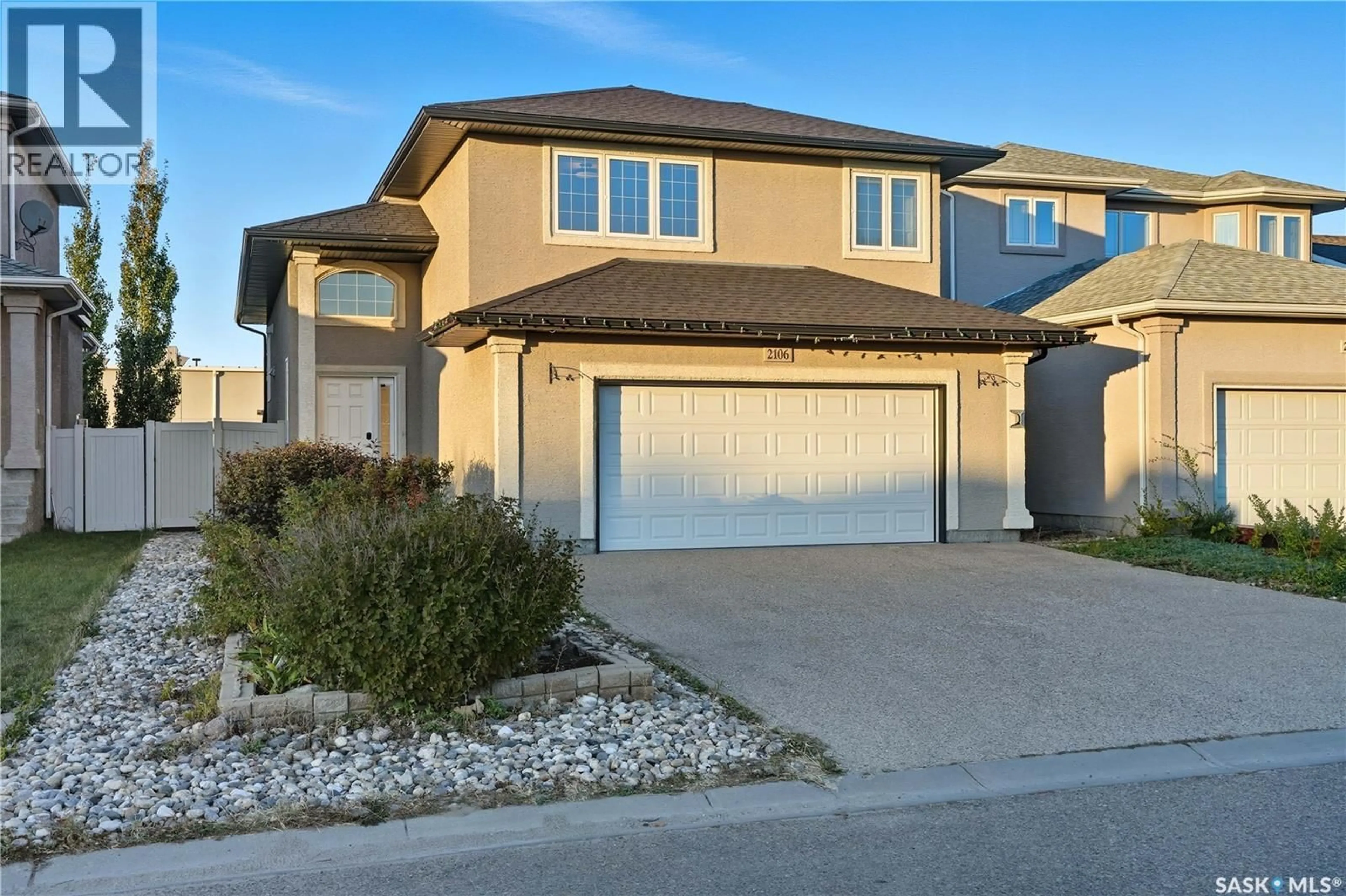 Home with vinyl exterior material, street for 2106 LAURIER CRESCENT, Regina Saskatchewan S4V0P6