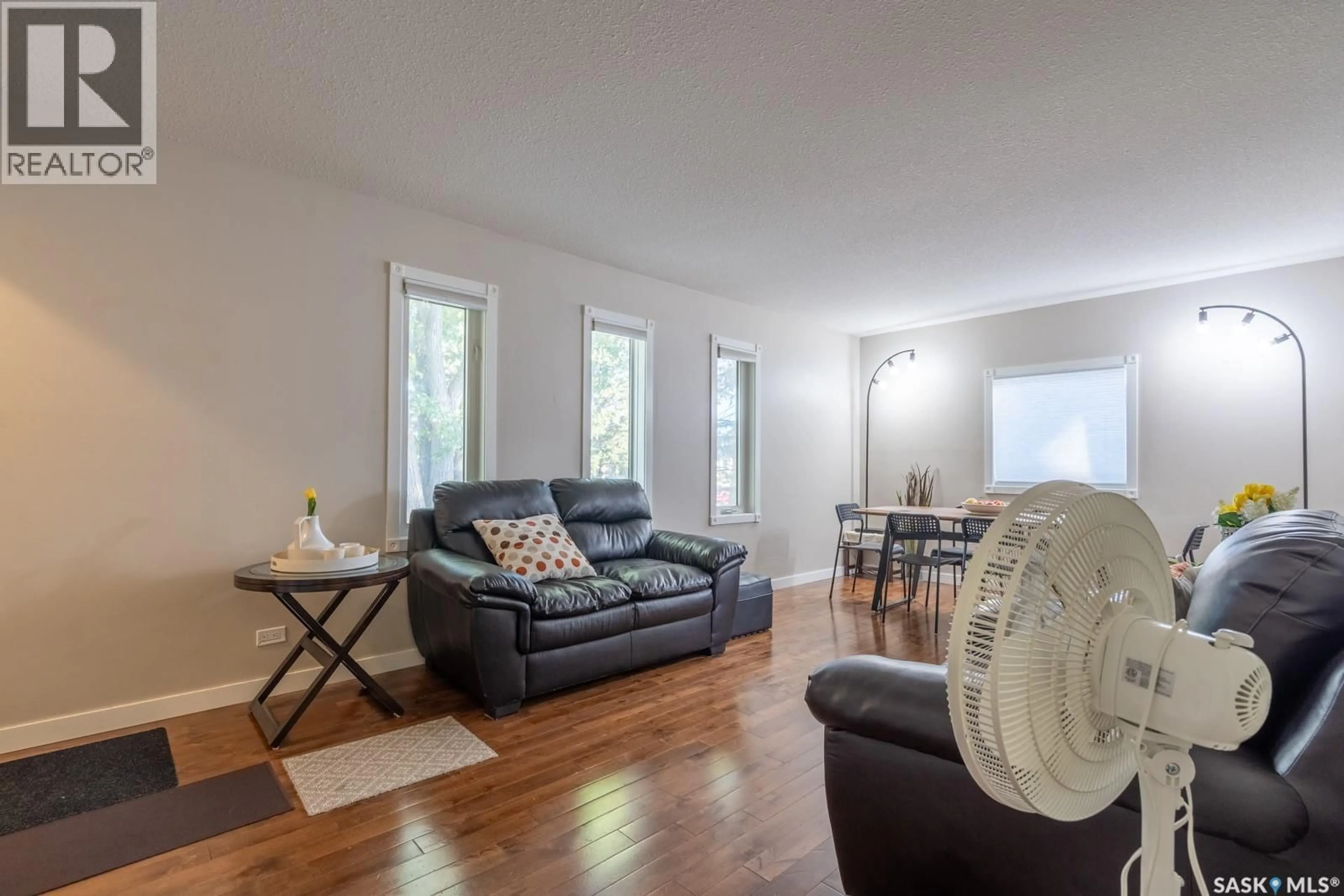 Living room with furniture, wood/laminate floor for 1742 ARTHUR STREET, Regina Saskatchewan S4T4W3
