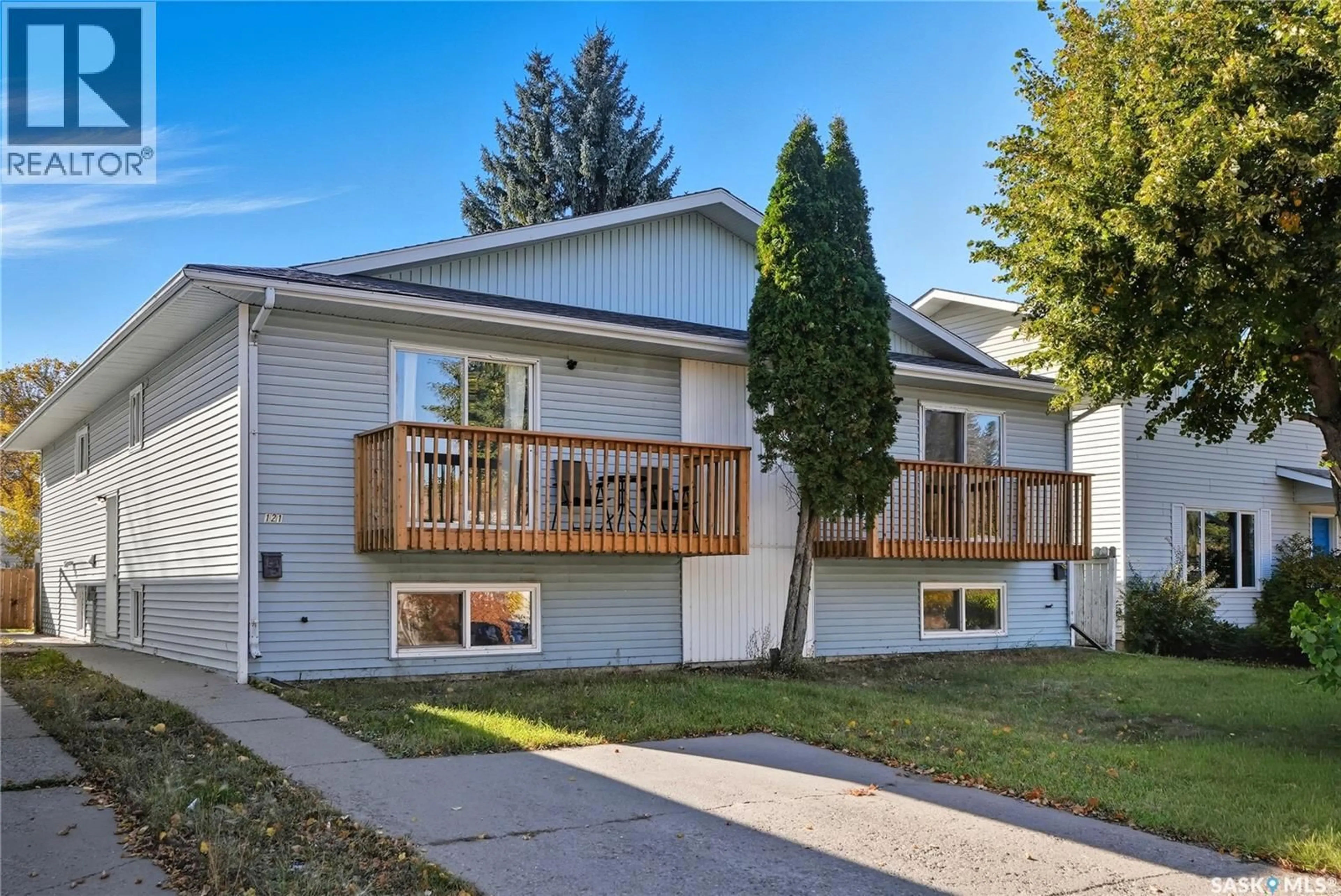 Home with vinyl exterior material, street for 119 - 121 OLMSTEAD ROAD, Saskatoon Saskatchewan S7M4L9