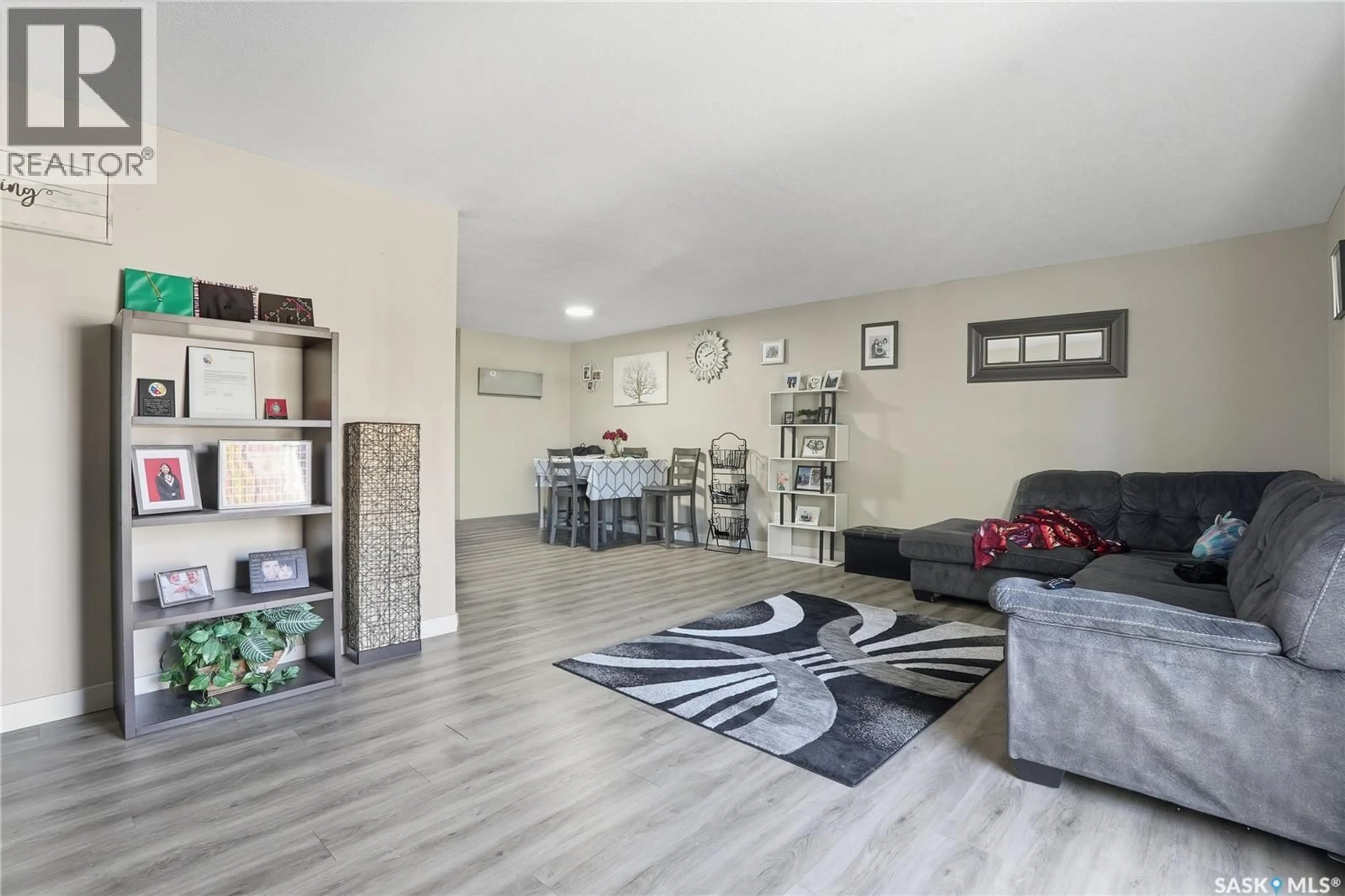 Living room with furniture, unknown for 119 - 121 OLMSTEAD ROAD, Saskatoon Saskatchewan S7M4L9