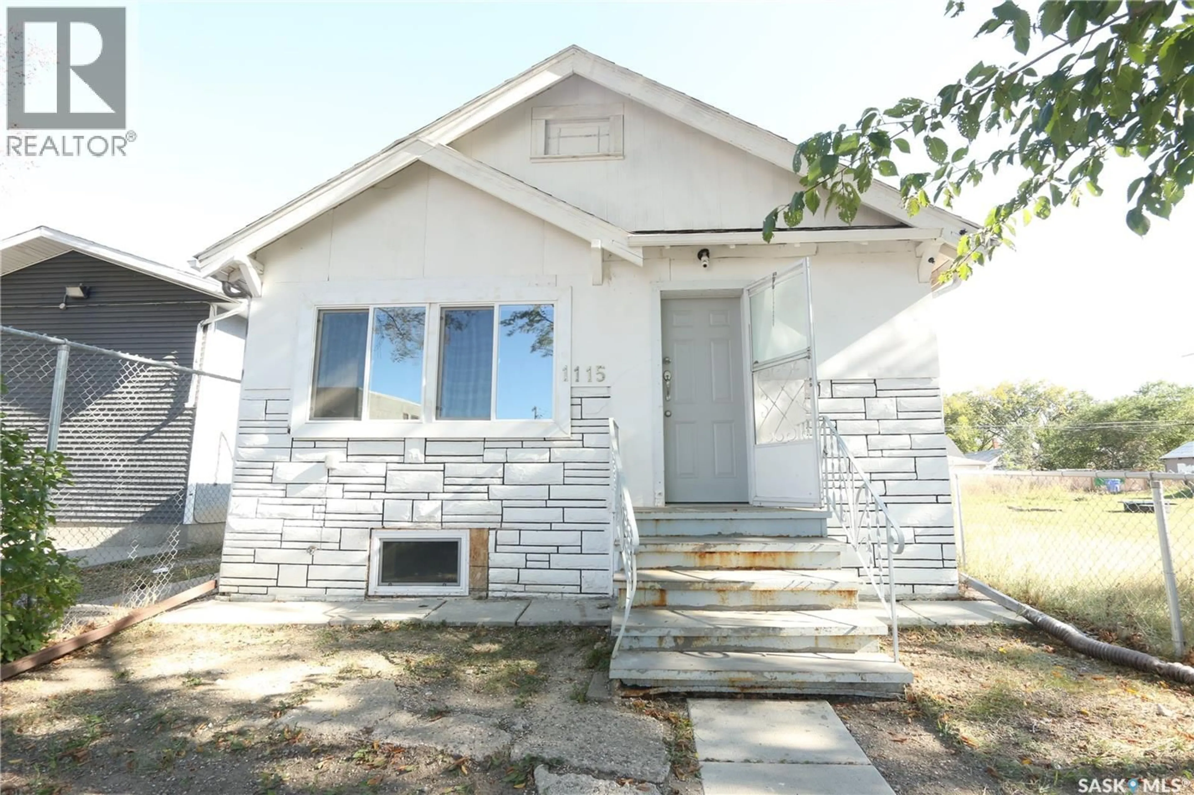 Home with vinyl exterior material, street for 1115 ROBINSON STREET, Regina Saskatchewan S4T2N1