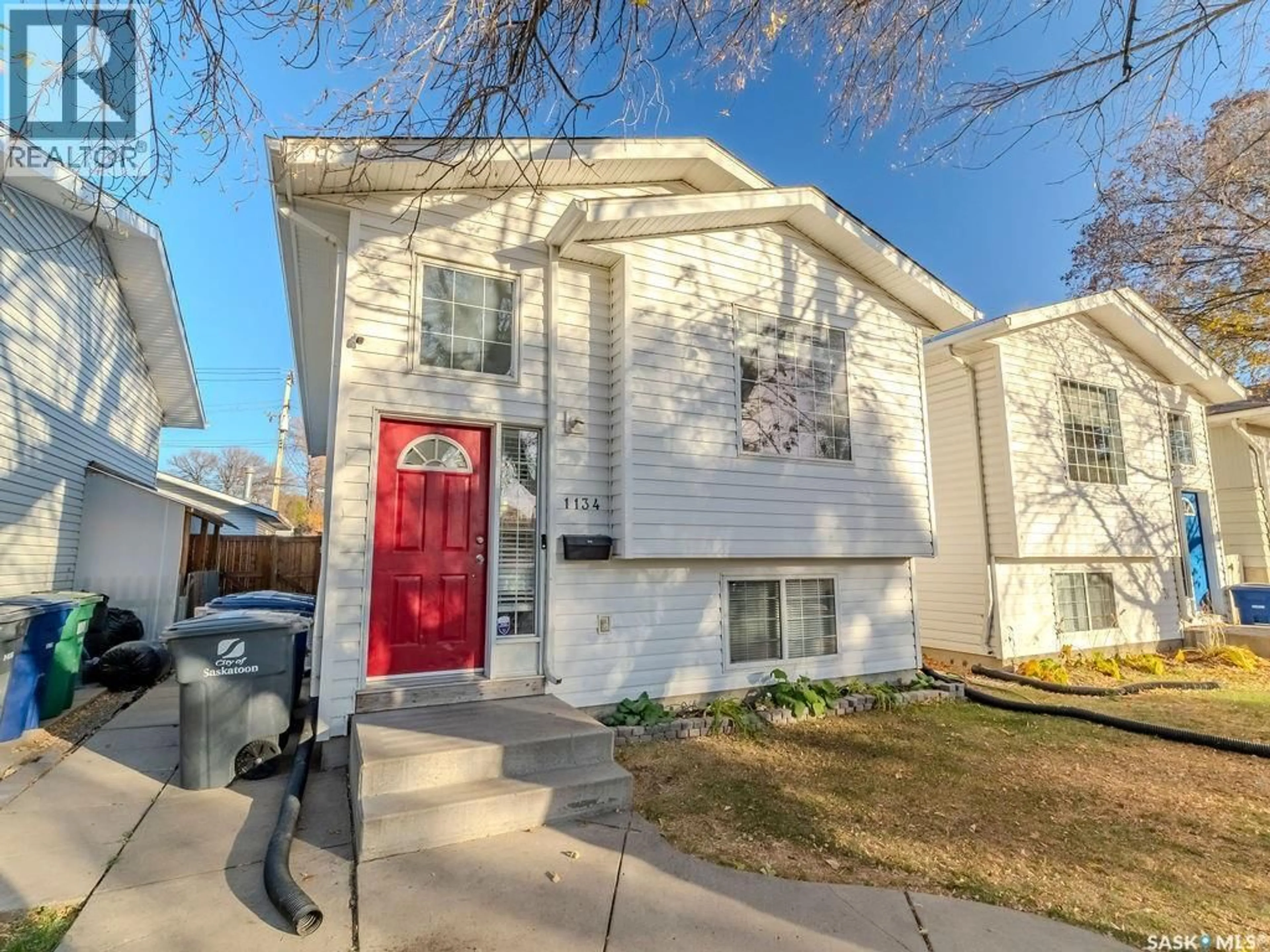 Home with vinyl exterior material, street for 1134 J AVENUE, Saskatoon Saskatchewan S7L2L6