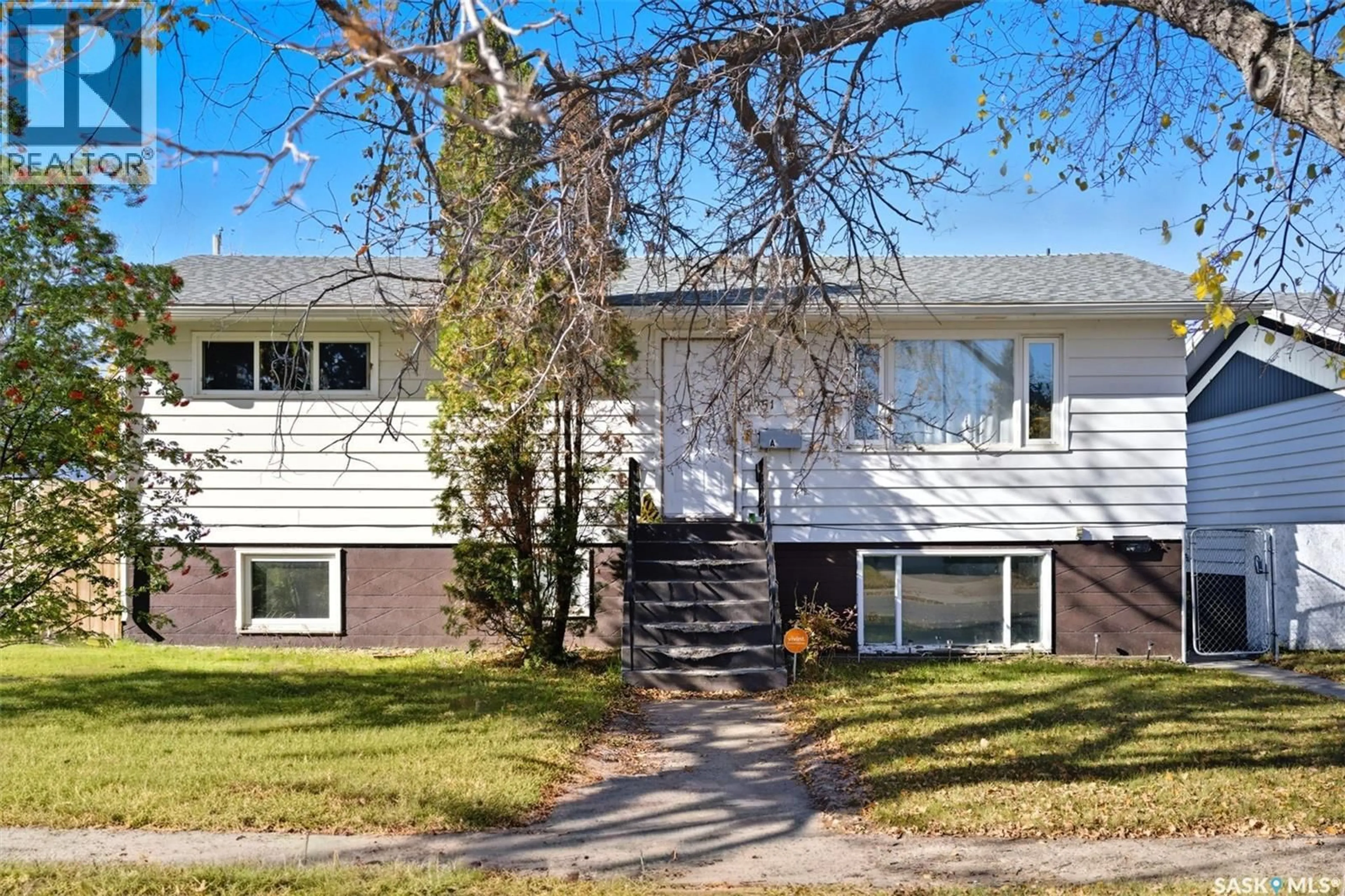 Home with vinyl exterior material, street for 1051 109TH STREET, North Battleford Saskatchewan S9A2E3