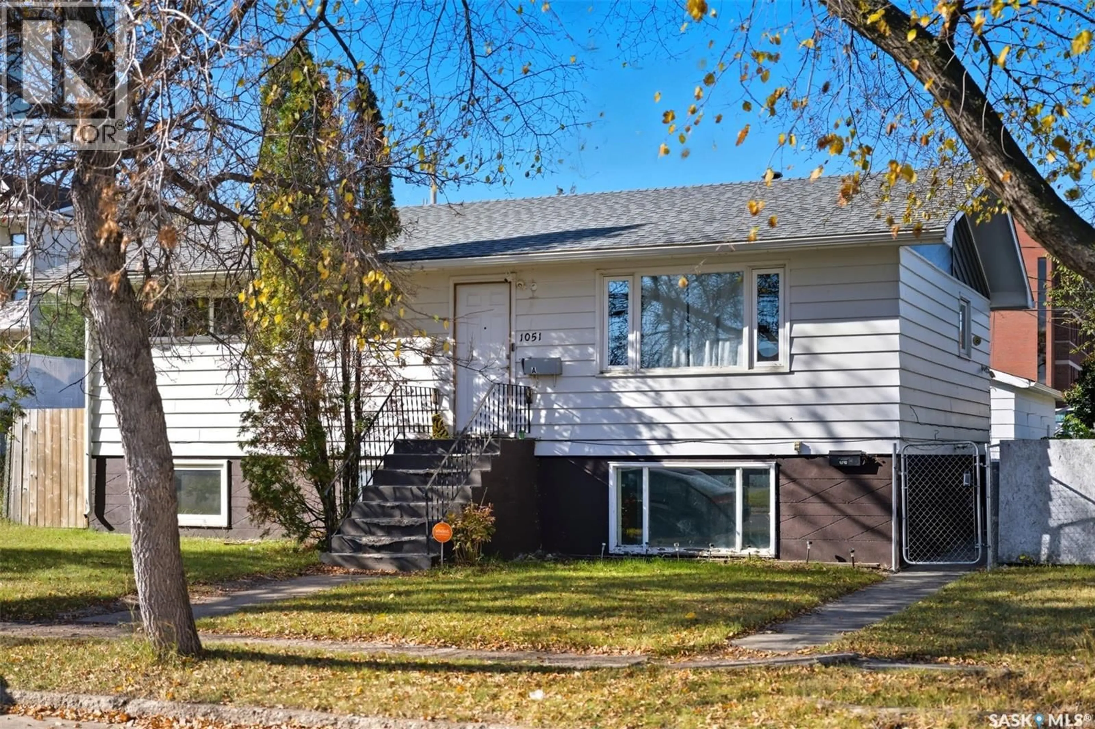 Home with vinyl exterior material, street for 1051 109TH STREET, North Battleford Saskatchewan S9A2E3