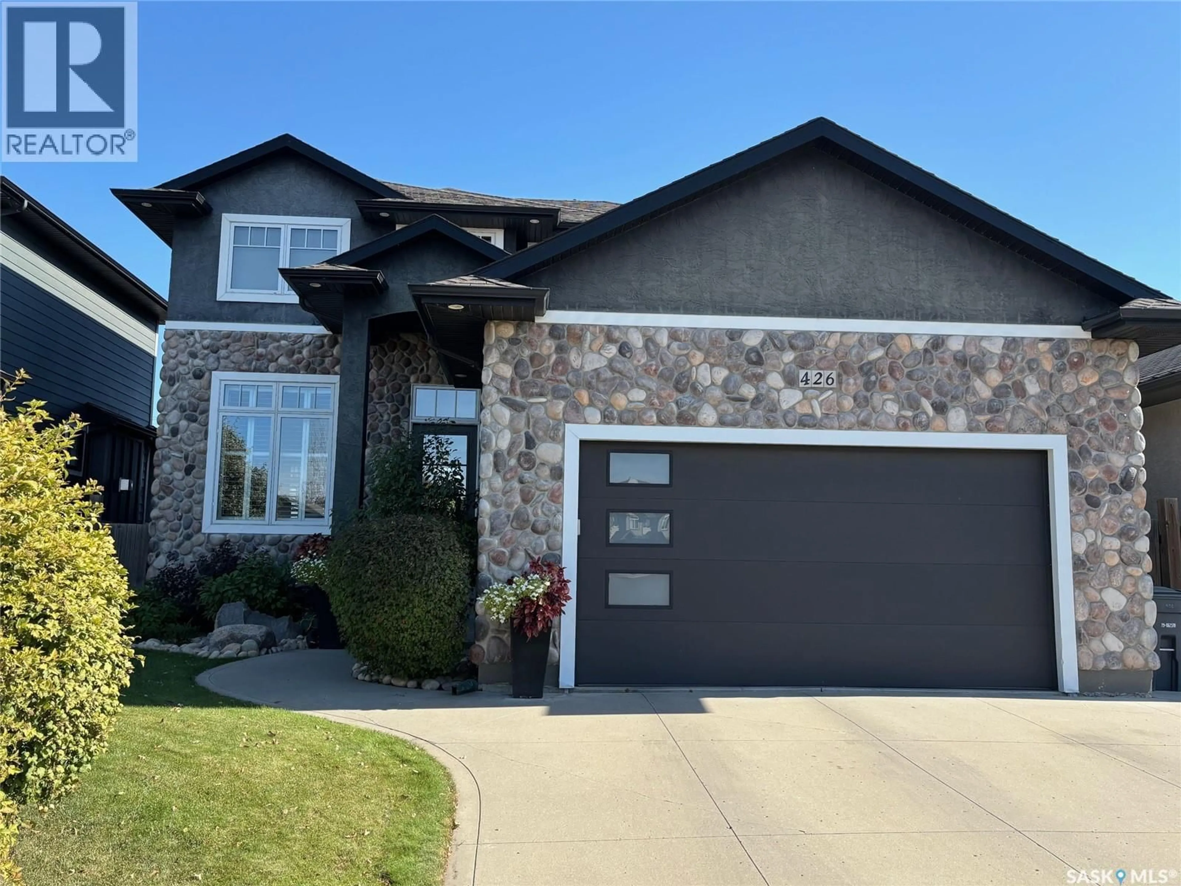 Home with brick exterior material, street for 426 LAMARSH ROAD, Saskatoon Saskatchewan S7W1B8