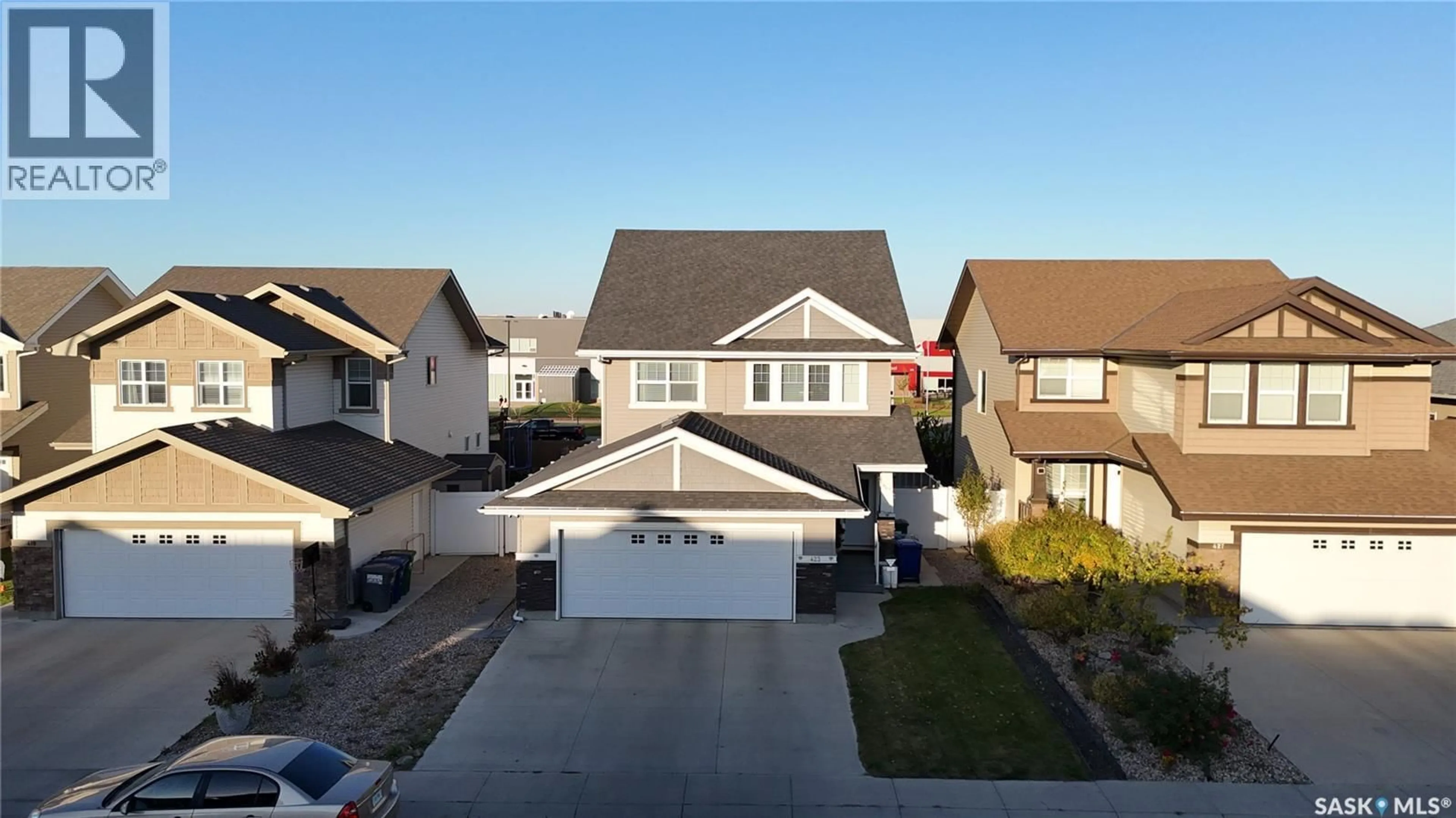 A pic from outside/outdoor area/front of a property/back of a property/a pic from drone, street for 423 FLYNN LANE, Saskatoon Saskatchewan S7V0L1