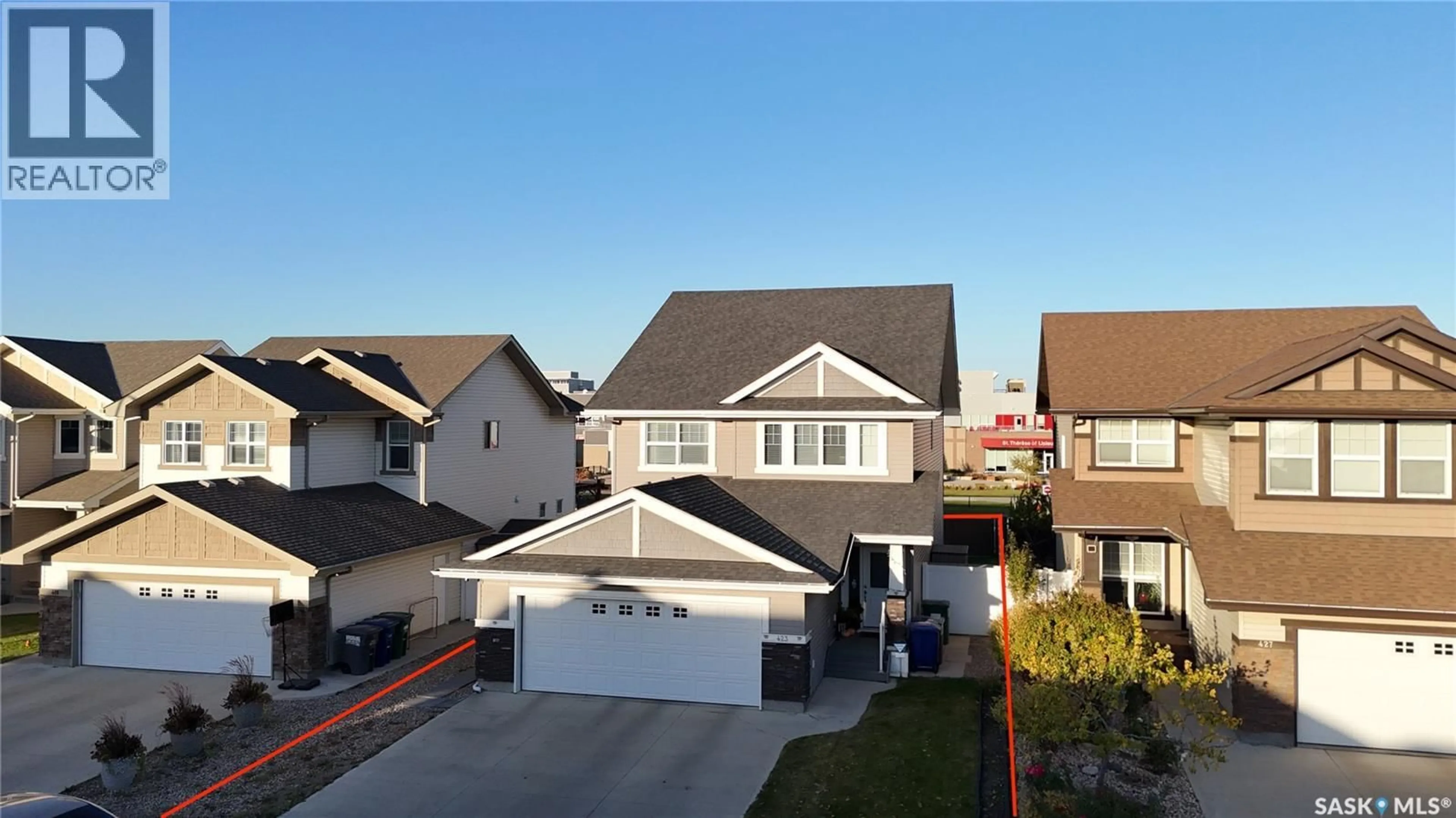 A pic from outside/outdoor area/front of a property/back of a property/a pic from drone, street for 423 FLYNN LANE, Saskatoon Saskatchewan S7V0L1